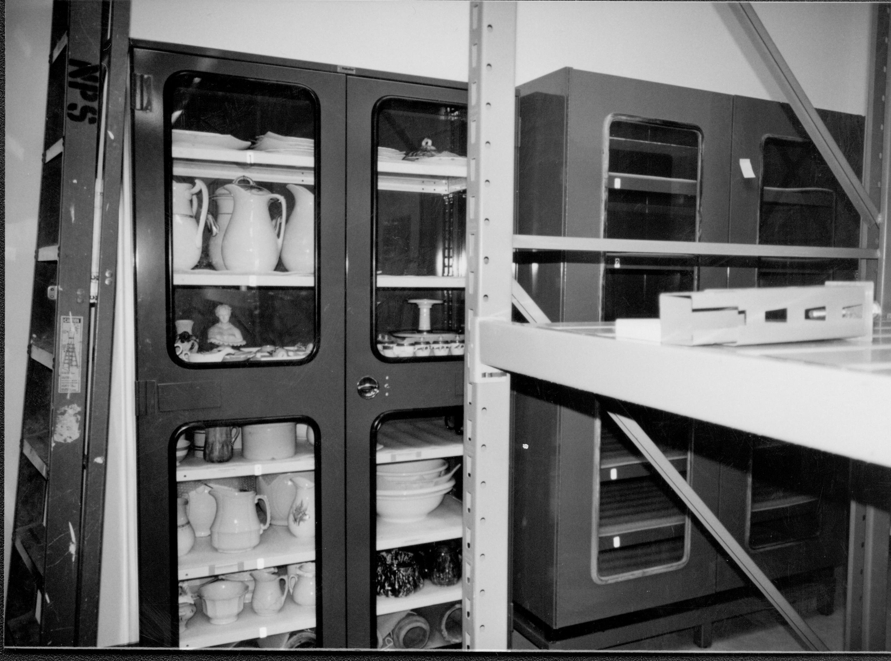 Gray case (ceramics) with artifacts installed Lincoln Home NHS, CRS Collection Move, East Wall, Roll N10, exp 14 sheet 4 of 7 Arnold Barn, storage, artifacts