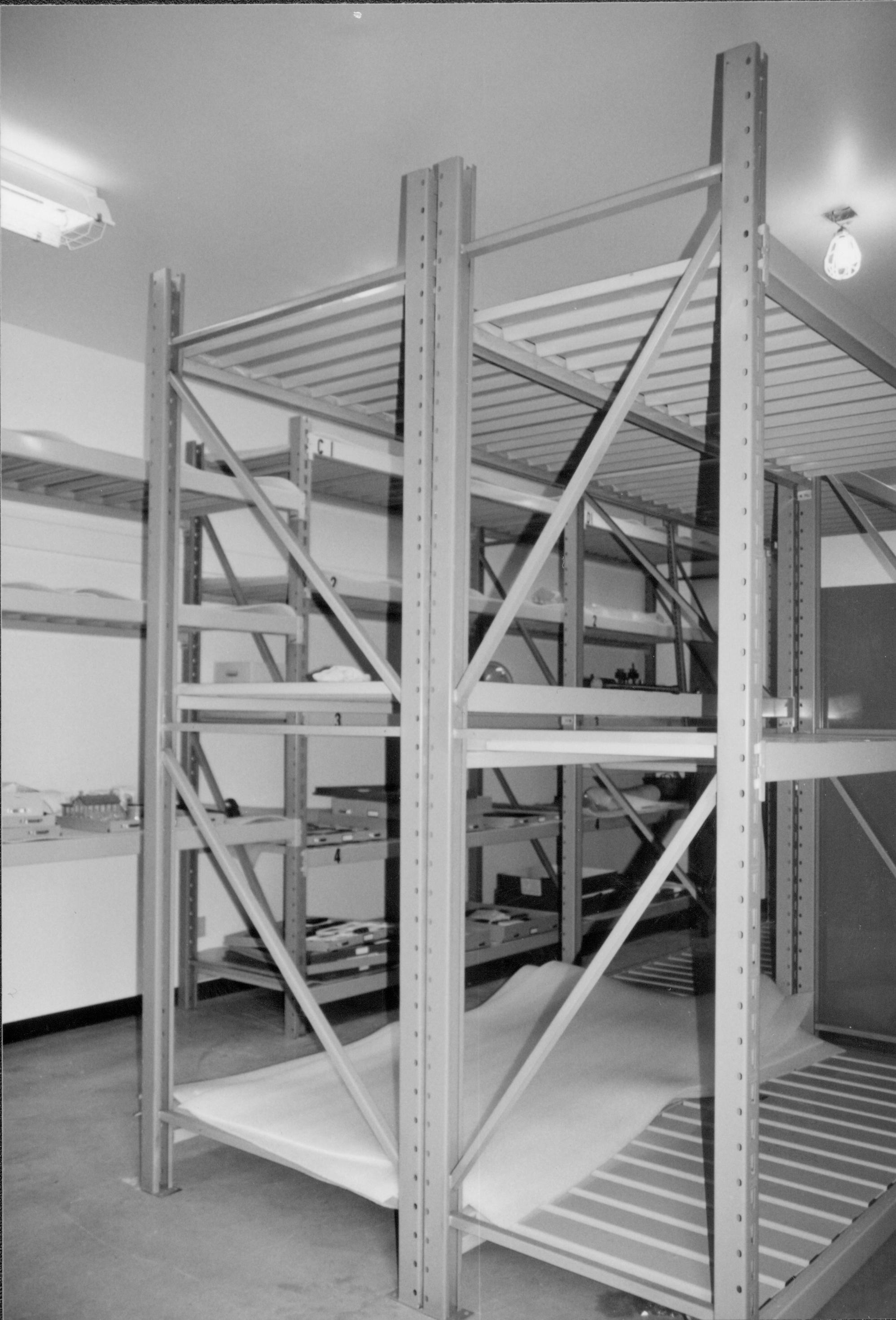 Center racks after installation. Photo taken standing at entrance (southwest) Lincoln Home NHS, CRS Collection Move, Facing North-Northeast, Roll N10, exp 23 sheet 6 of 7 Arnold Barn, storage, artifacts