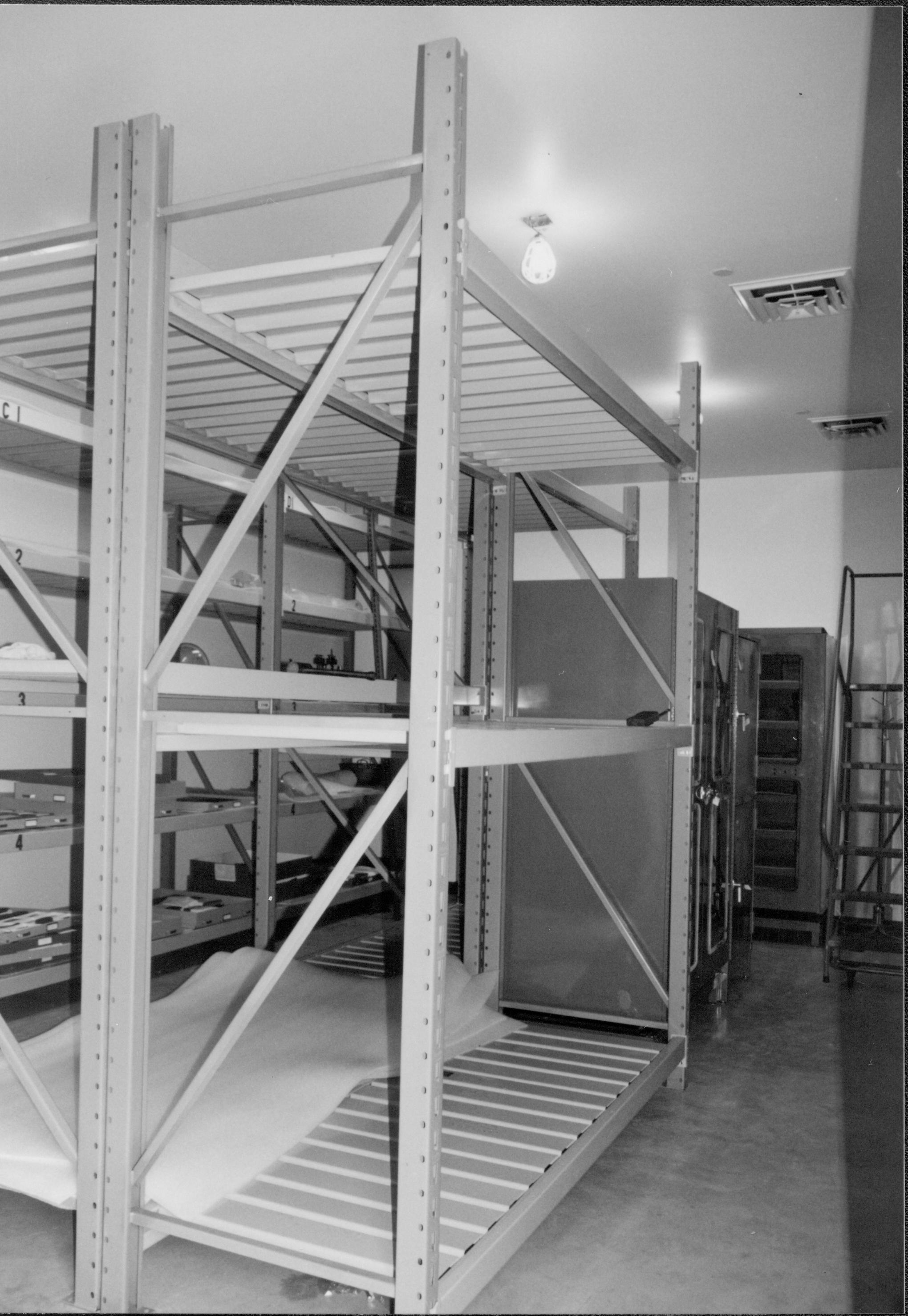 Center racks after installation. Photo taken standing at entrance (southwest) Lincoln Home NHS, CRS Collection Move, Facing North-Northeast, Roll N10, exp 24 sheet 6 of 7 Arnold Barn, storage, artifacts