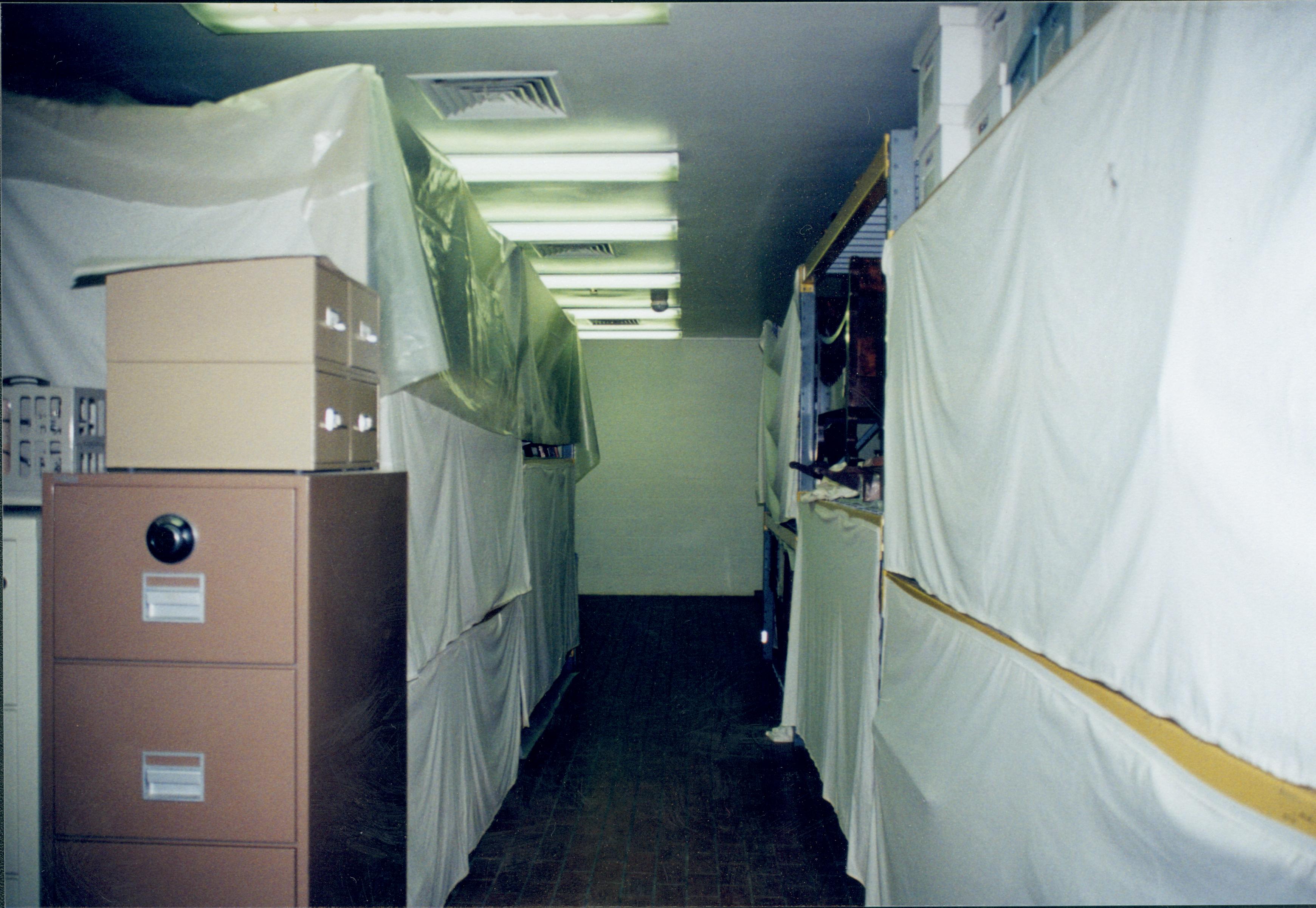 Looking towards North wall, along aisle between 4 foot racks Lincoln Home NHS, 1998 CRS Collection Move, Roll N7, exp 1 sheet 1 of 9 Carriage House, storage room