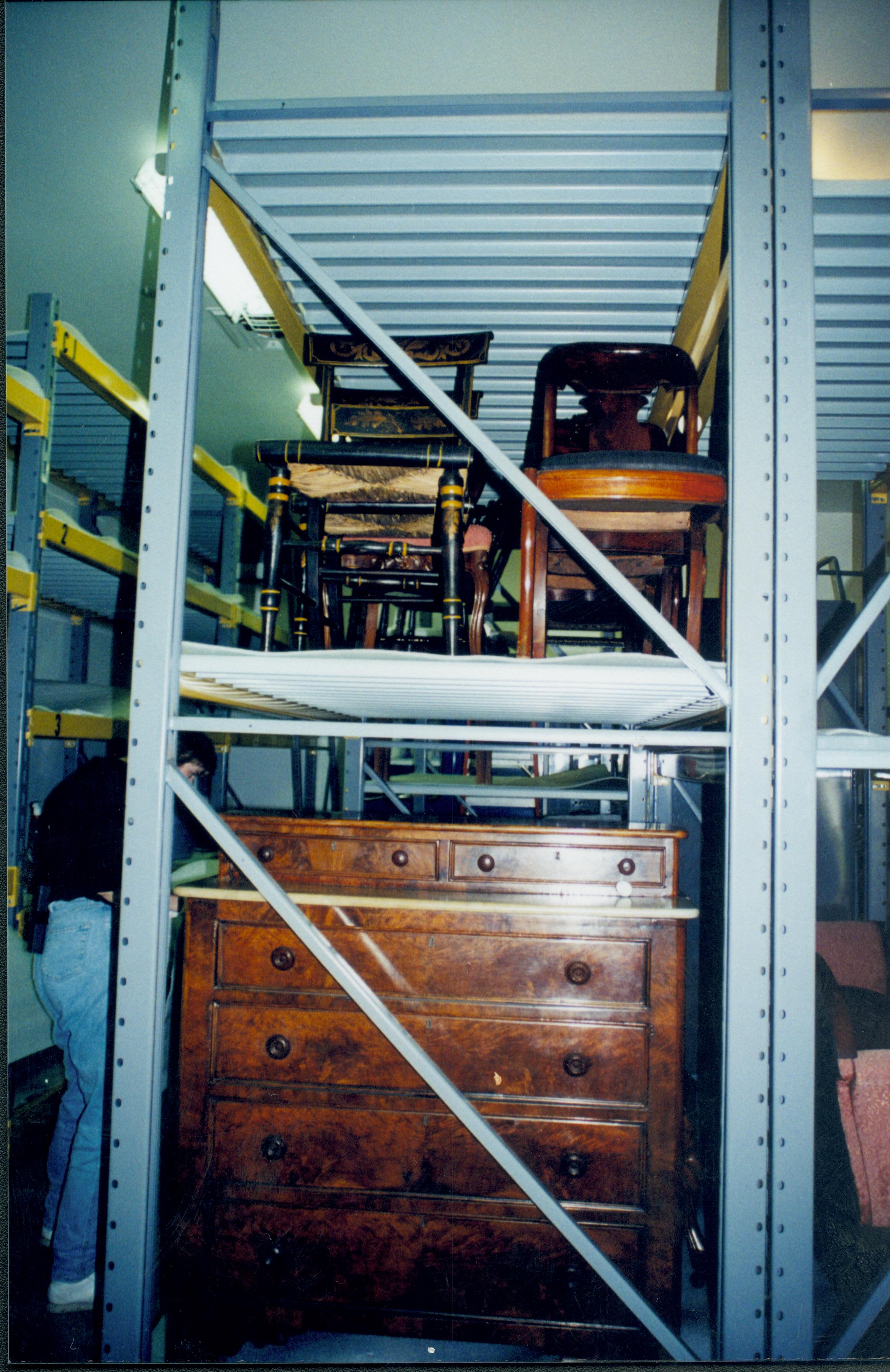 Chairs, bureau, etc. held in storage. K storage rack Lincoln Home NHS, 1998 CRS Collection Move, Roll N7, exp 24 sheet 9 of 9 Arnold Barn, storage room, furnishings