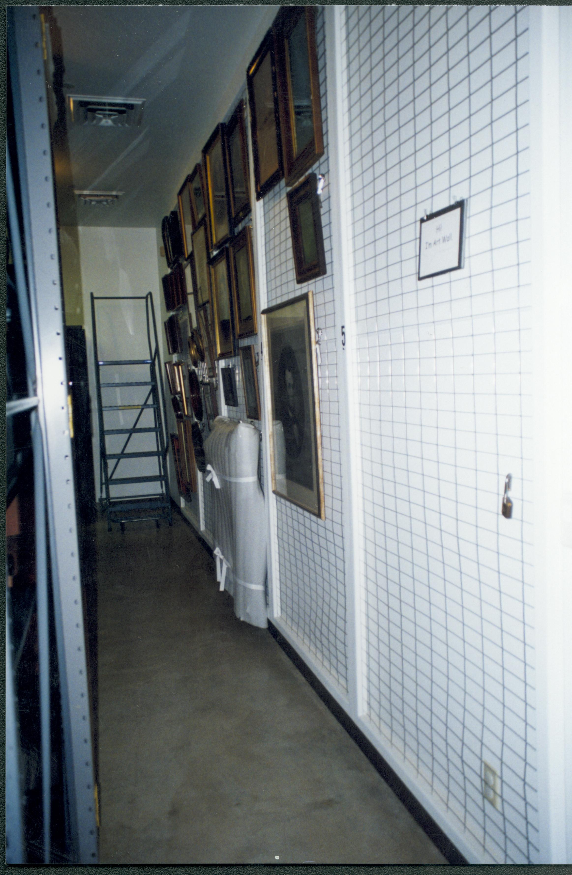 Art wall (South) with artifacts in place. Photo taken from South entrance, looking East down South aisle Lincoln Home NHS, CRS Artifacts Move, Roll N13, exp 27 sheet 4 of 6 Arnold Barn, storage room