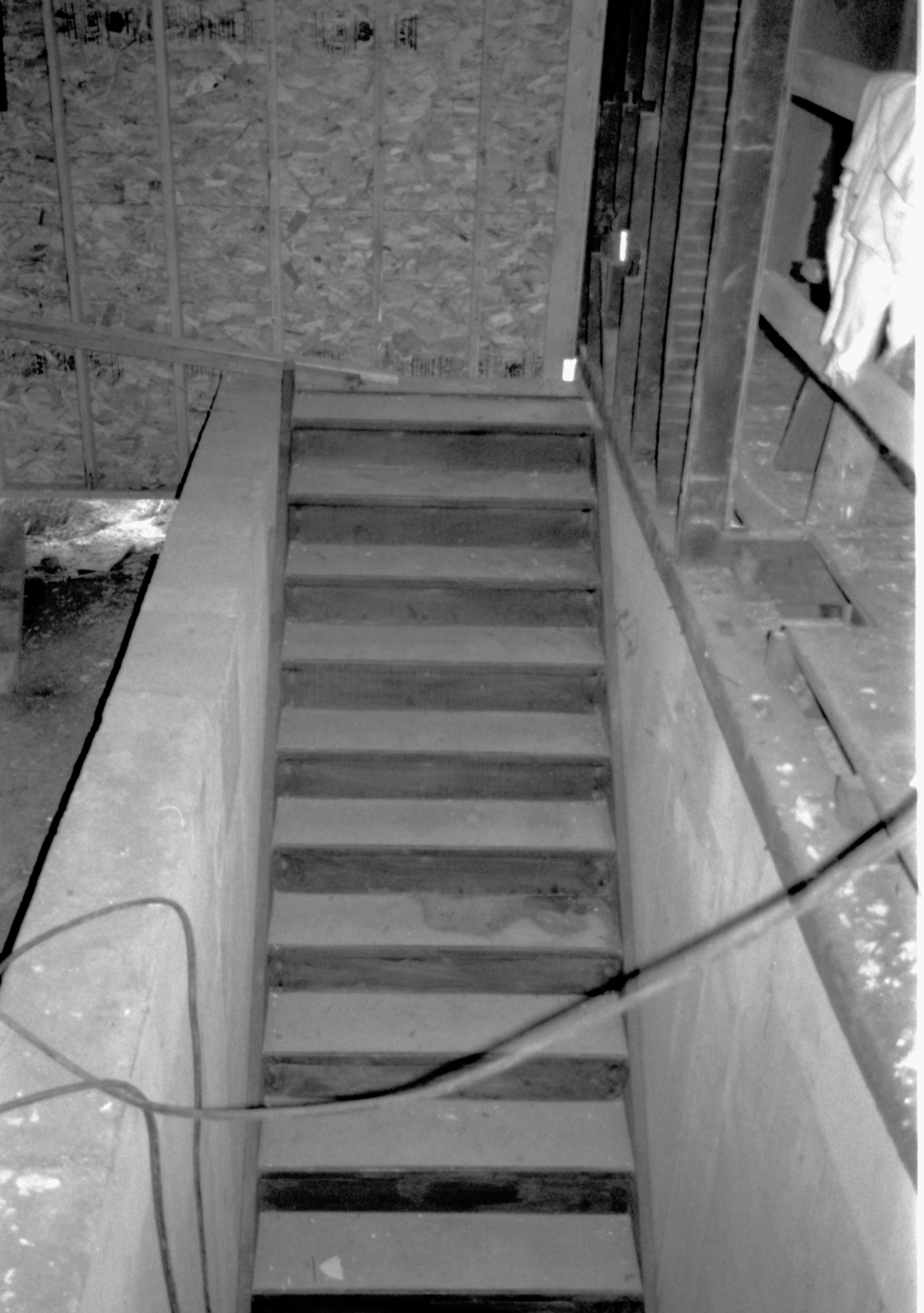 Stairway leading from gound floor to basement. Photo from 1st floor, looking West Lincoln Home NHS, CRS Artifacts Move, Roll N11, exp 18 Corneau House, renovation