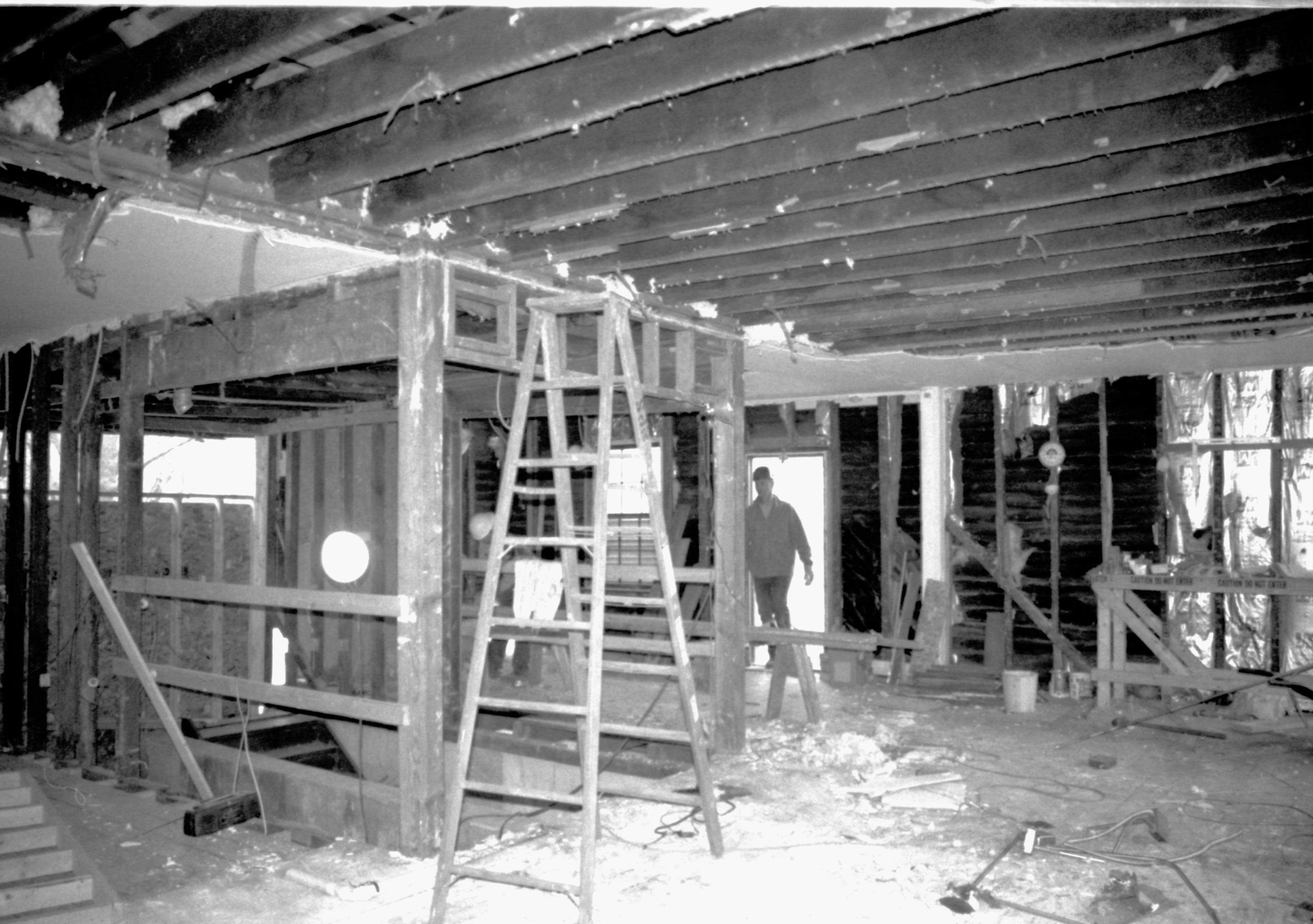 Standing at Southeast corner of main room (East), looking towards Northeast (Smith entering North door) Lincoln Home NHS, CRS Artifacts Move, North and West walls, Roll N11, exp 21 Corneau House, renovation