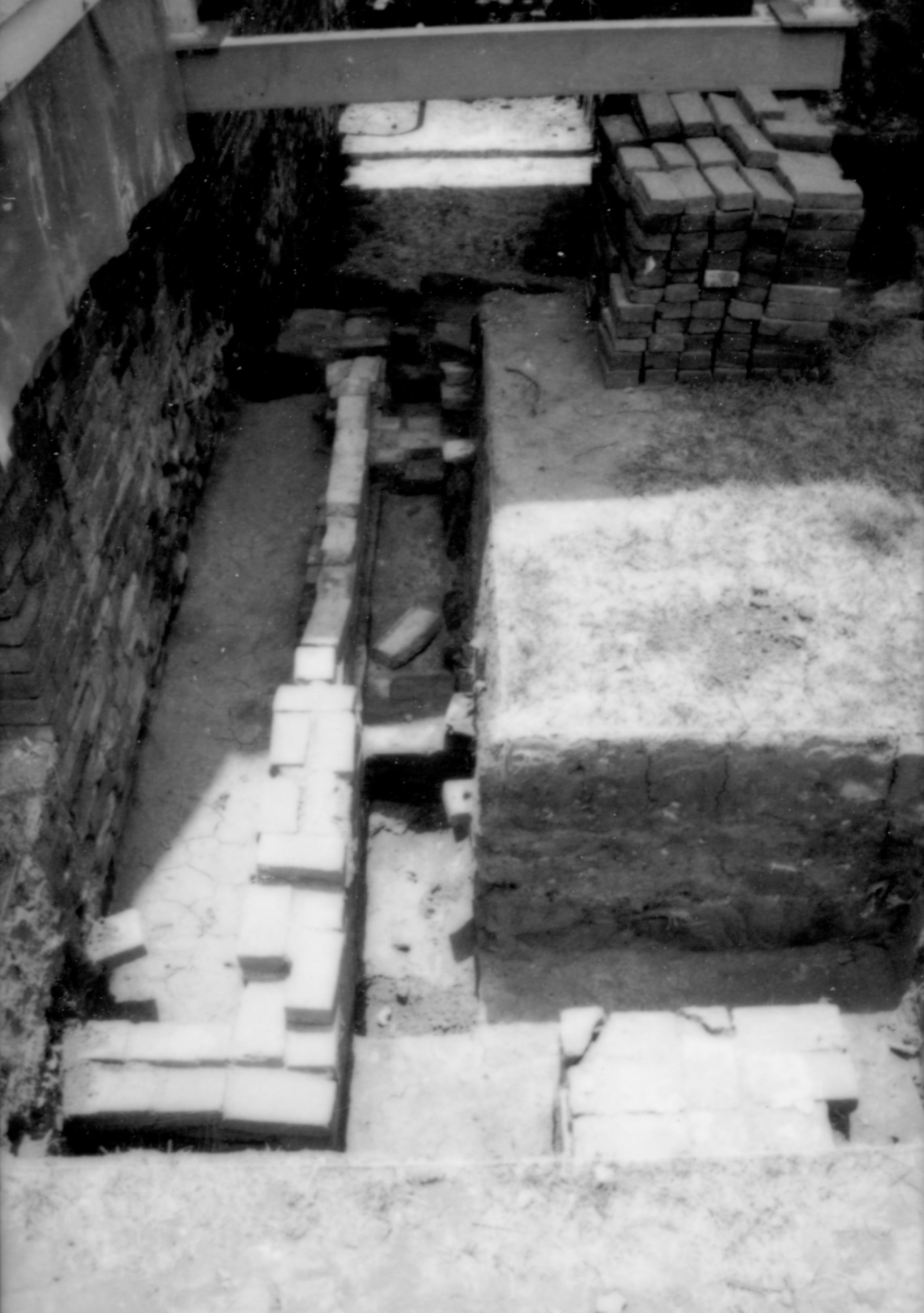 East- Archeological excavation under south porch Lincoln Home NHS, CRS Collections Move, Arnold Barn Foundations, Roll N16, exp 24 Dubois, cistern, excavation