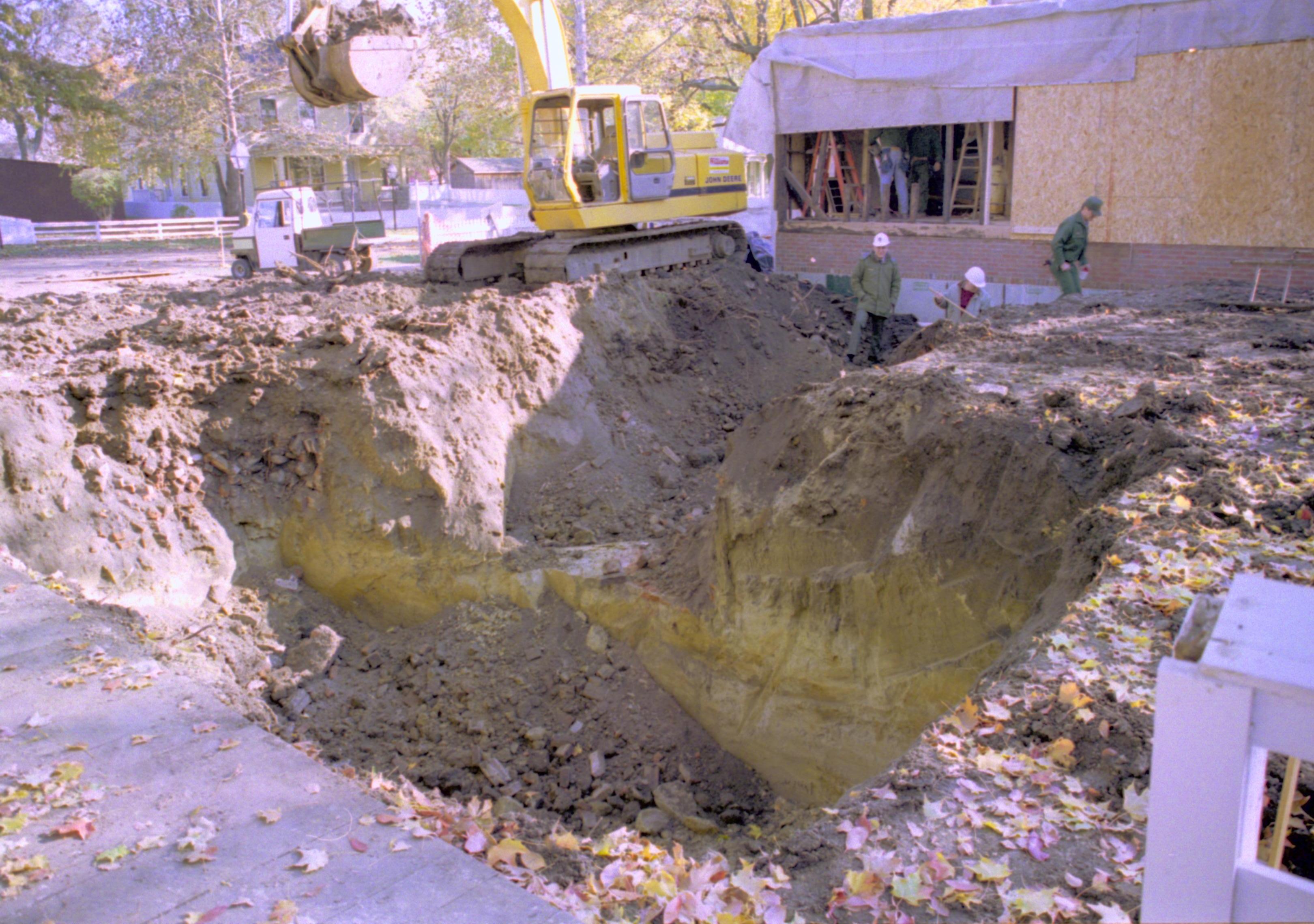 Excavating foundation for Corneau (Blake, Pllock, and Mansberger). North wall Sprigg in background Lincoln Home NHS, Corneau lot facing Southeast, Roll N5, exp 13, sheet 1 of 2 LIHO, Corneau, excavation