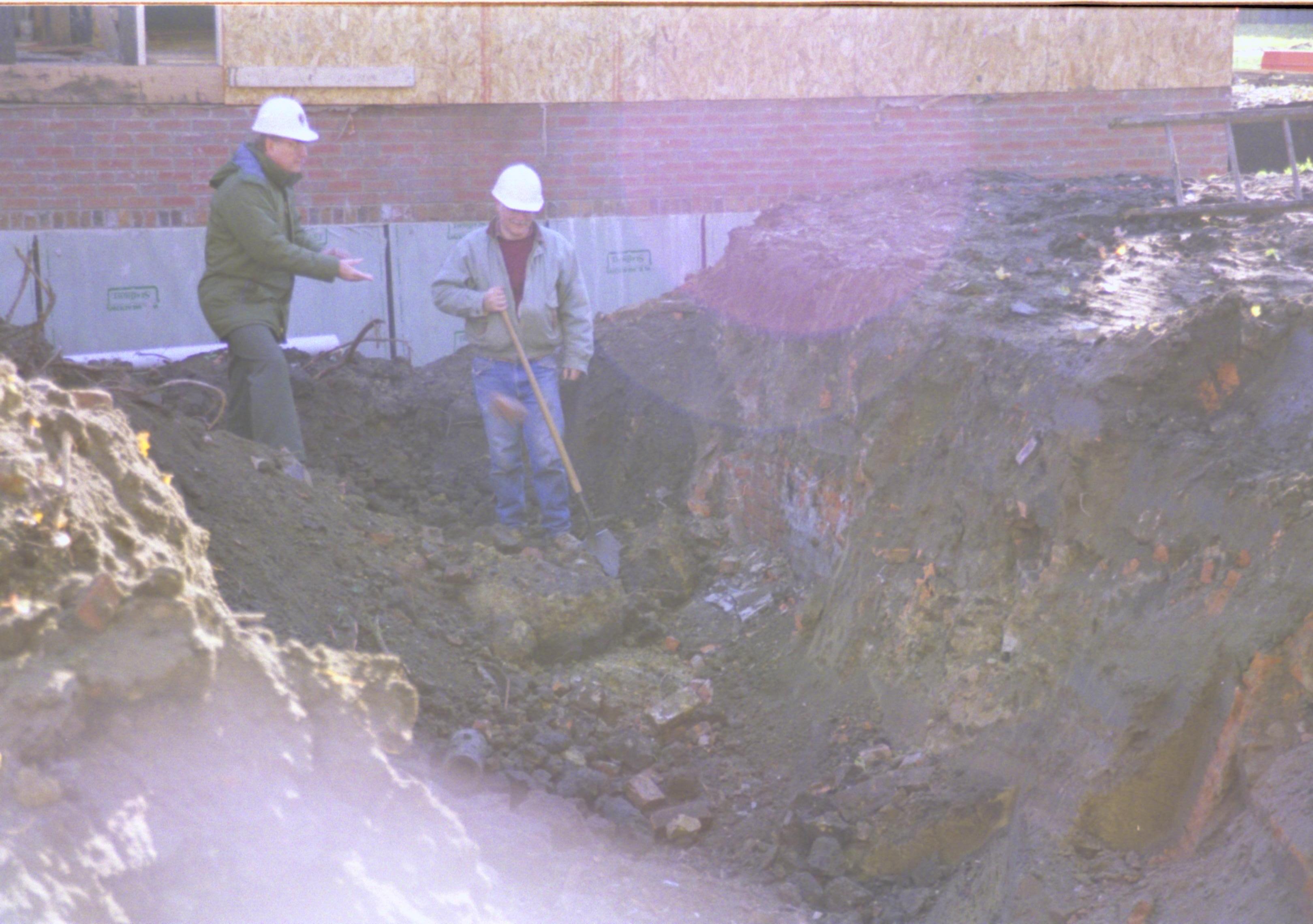 Excavating foundations for Corneau (Blake and Mansberger). North wall Sprigg in background Lincoln Home NHS, Corneau lot facing South, Roll N5, exp 15, sheet 1 of 2 LIHO, Corneau, excavation