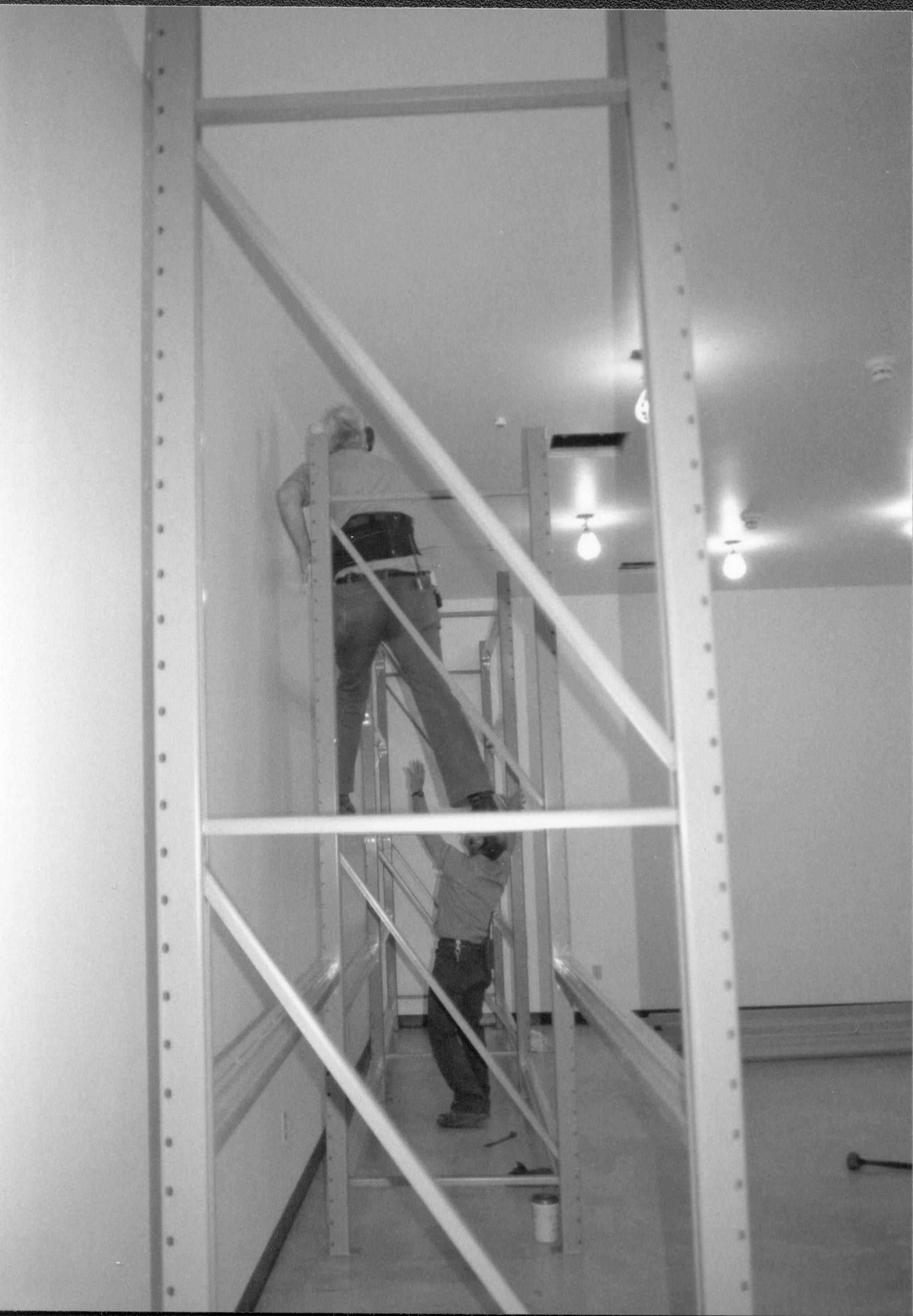 Storage shelves built and installed along the North wall in the Arnold Barn Facility Lincoln Home NHS, CRS Collection Move, Arnold Barn, Roll N11, exp 6, sheet 2 of 5 Arnold Barn, move, storage