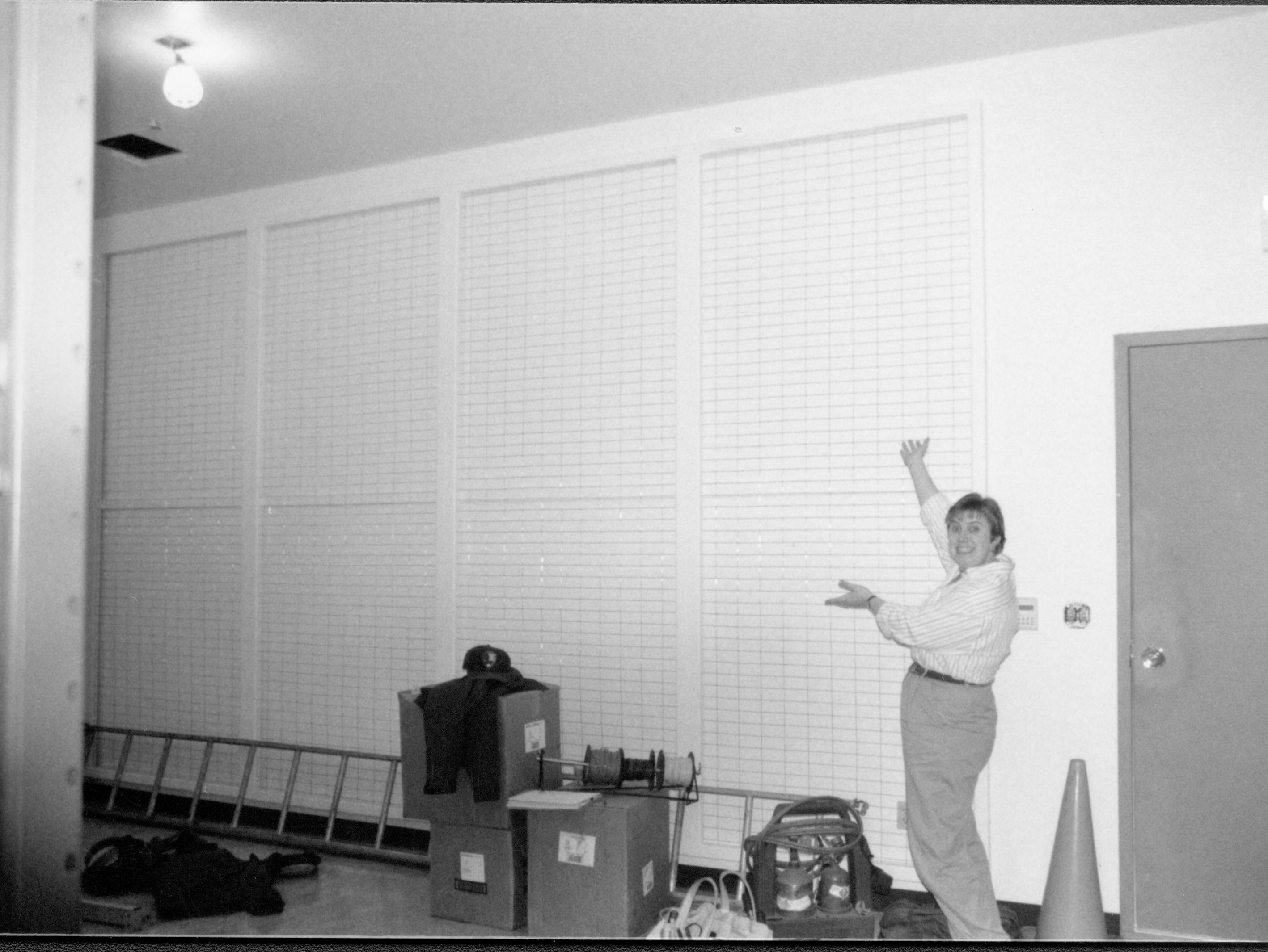 Art Wall/storage racks installed on the South wall of the Arnold Barn storage facility  Lincoln Home NHS, CRS Collection Move, Arnold Barn, Roll N11, exp 7, sheet 2 of 5 Arnold Barn, move, storage