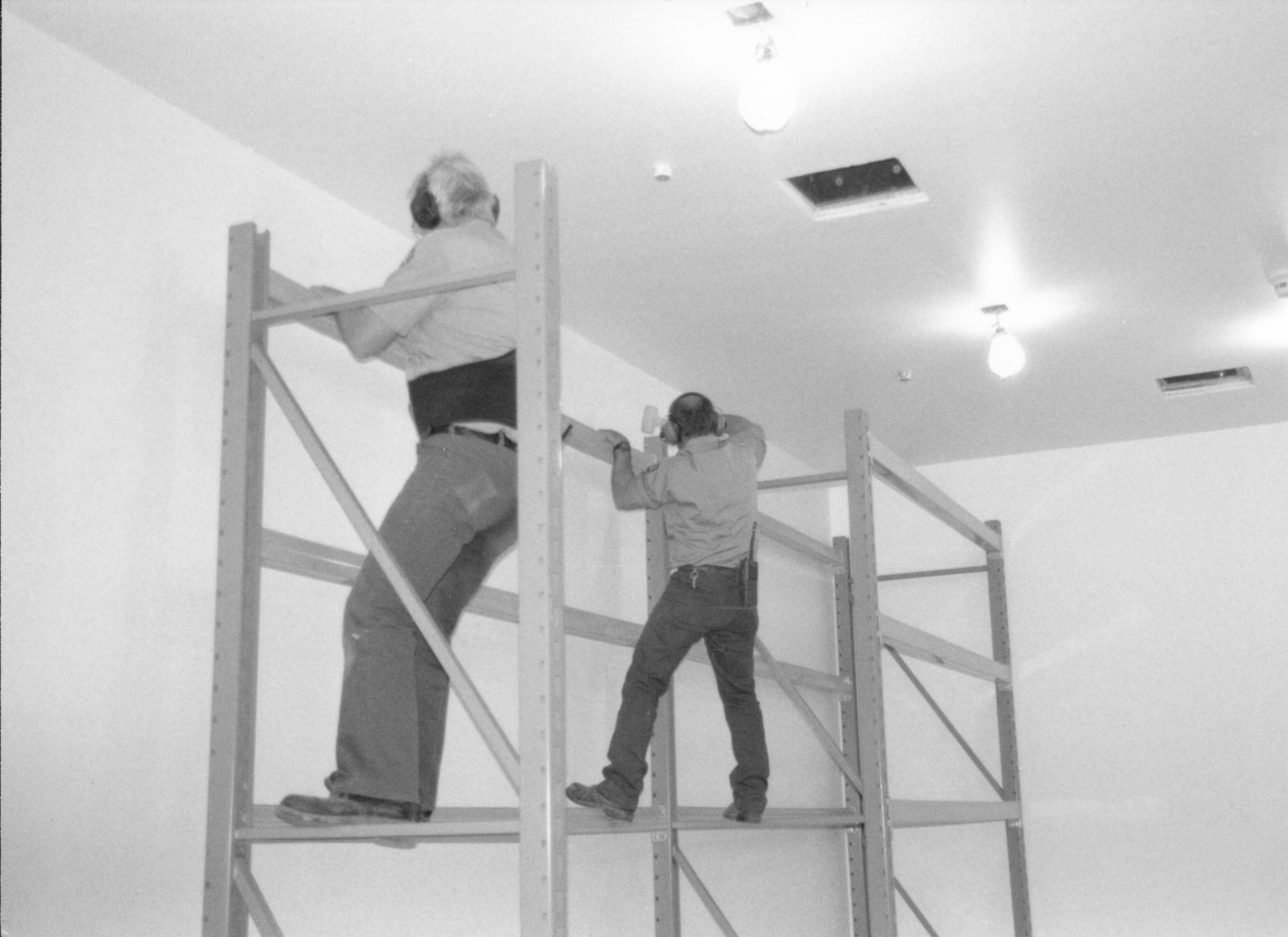 Storage shelves built and installed along the North wall in the Arnold Barn facility Lincoln Home NHS, CRS Collection Move, Arnold Barn, Roll N11, exp 9, sheet 3 of 5 Arnold Barn, move, storage