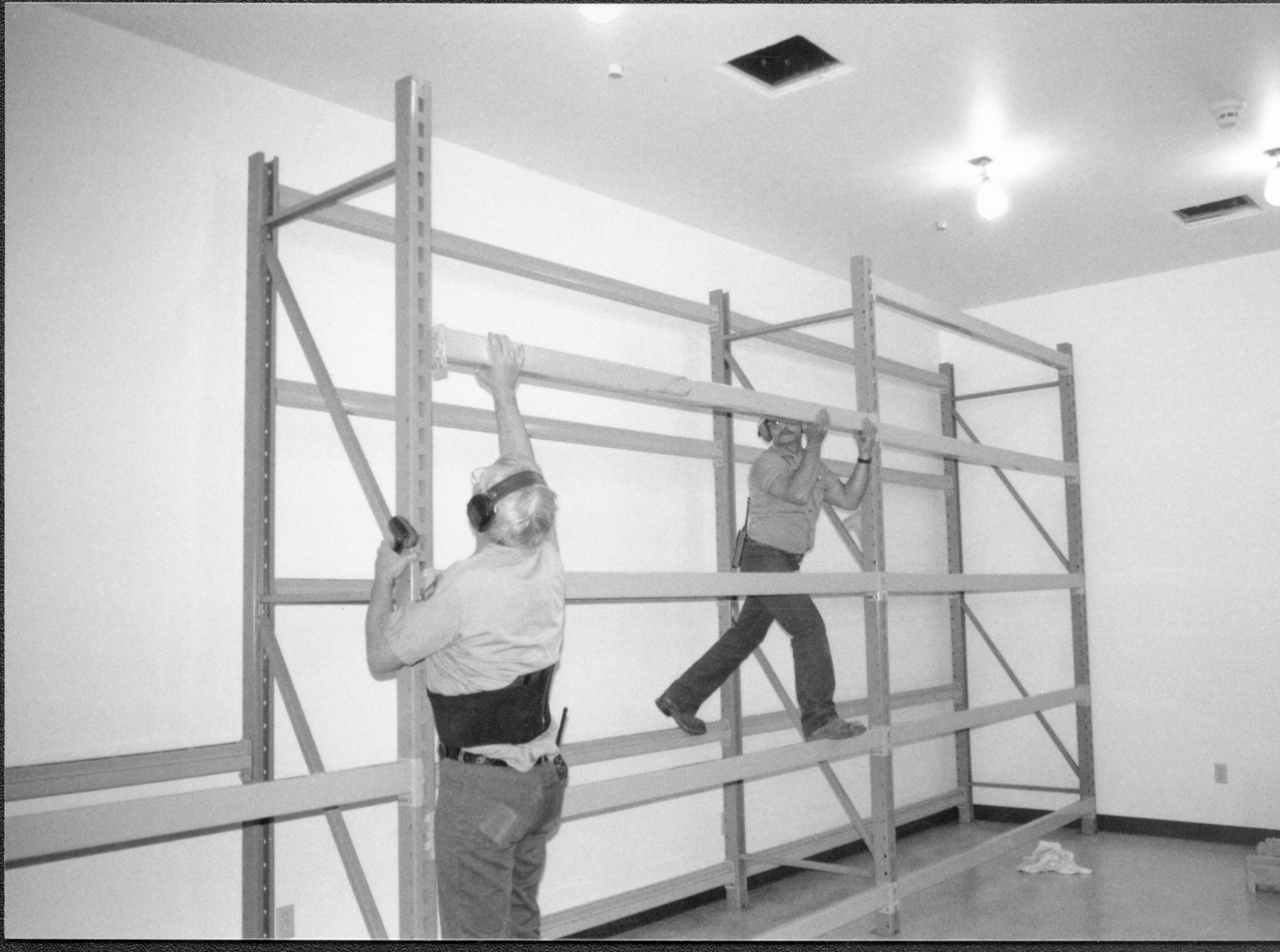 Storage shelves built and installed along the North wall in the Arnold Barn facility Lincoln Home NHS, CRS Collection Move, Arnold Barn, Roll N11, exp 11, sheet 3 of 5 Arnold Barn, move, storage