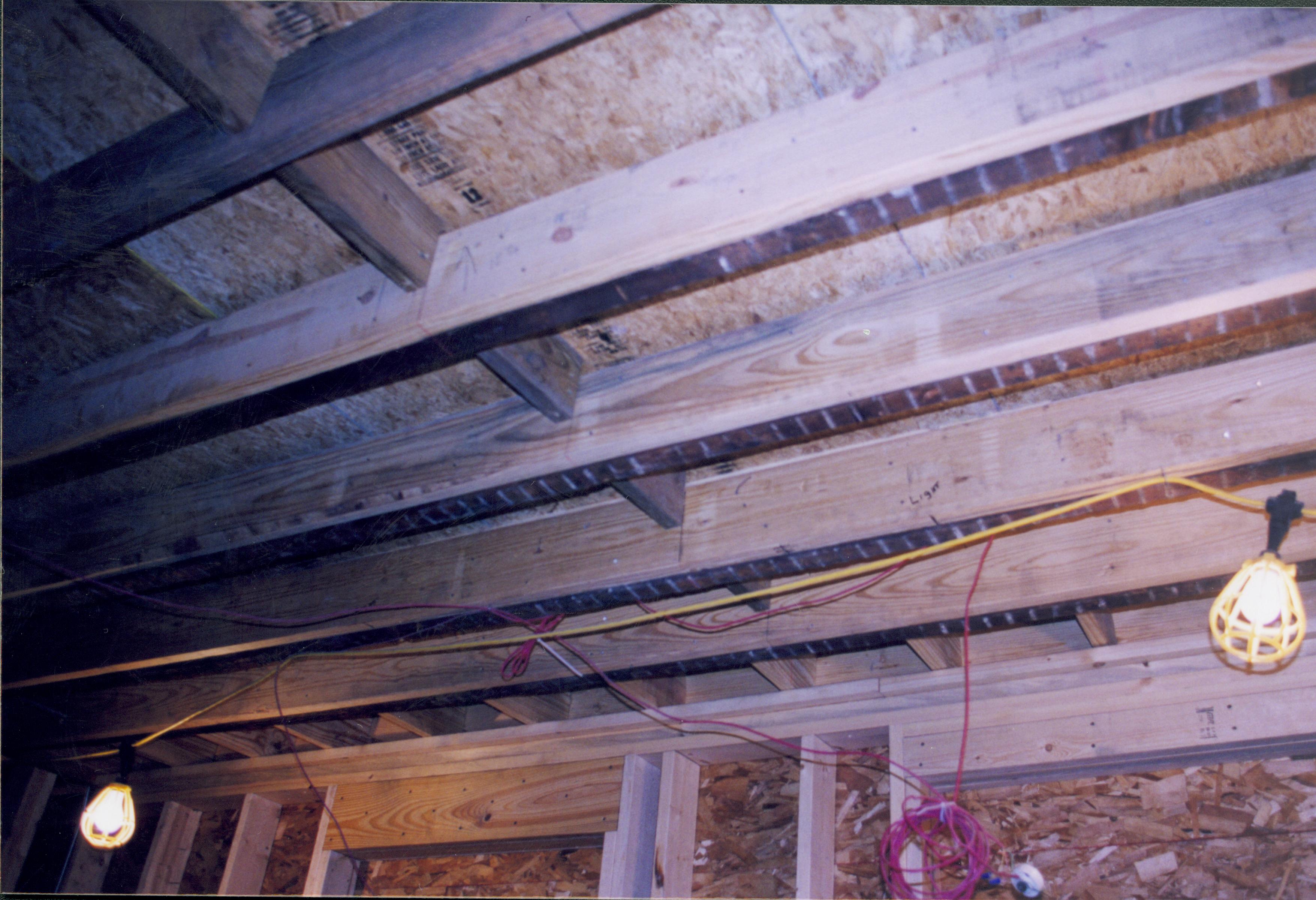 Dubois House restoration - new ceiling joists sistered in with original. New plywood subflooring visible above joists Looking South from Dubois House Dubois, joists, ceiling, sub-flooring, utility lights
