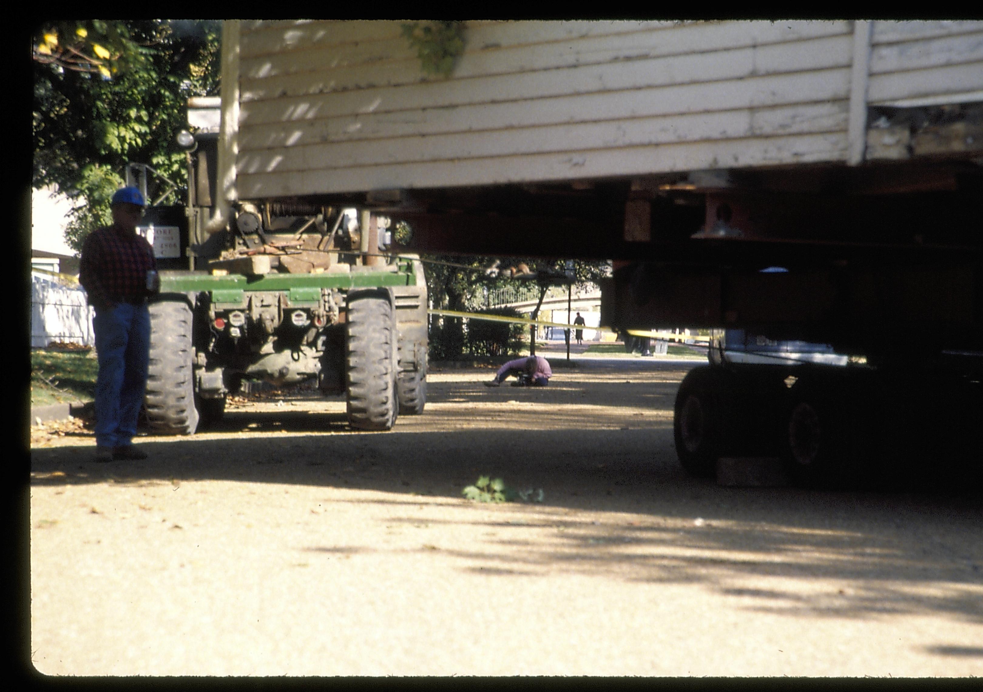 Corneau House on street being filmed by Susan Haake Lincoln Home NHS- Corneau House move, Roll #1 color slides, exp 24 Corneau House, move