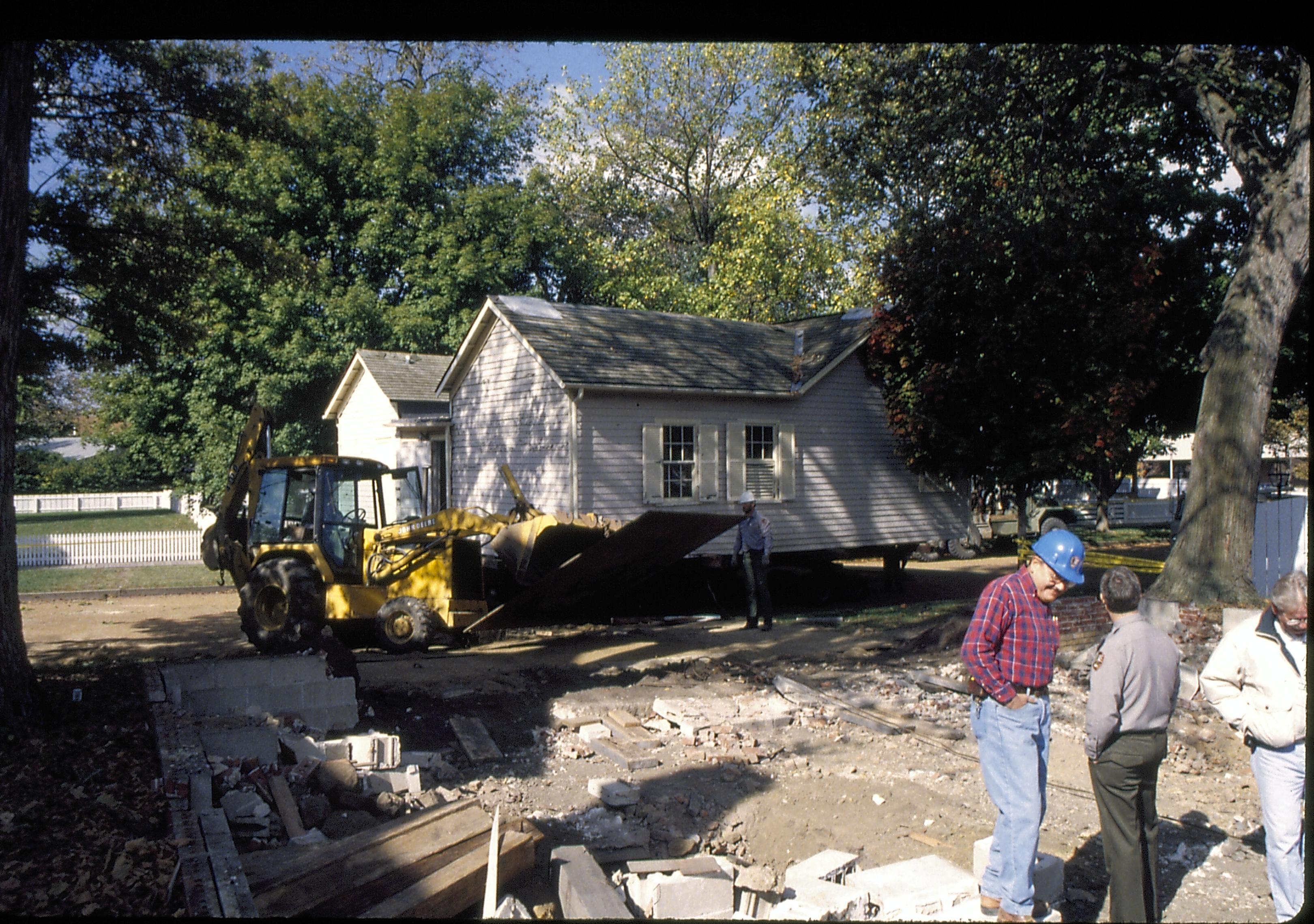 Corneau on street from former location Lincoln Home NHS- Corneau House move, Roll #1 color slides, exp 30 Corneau House, move