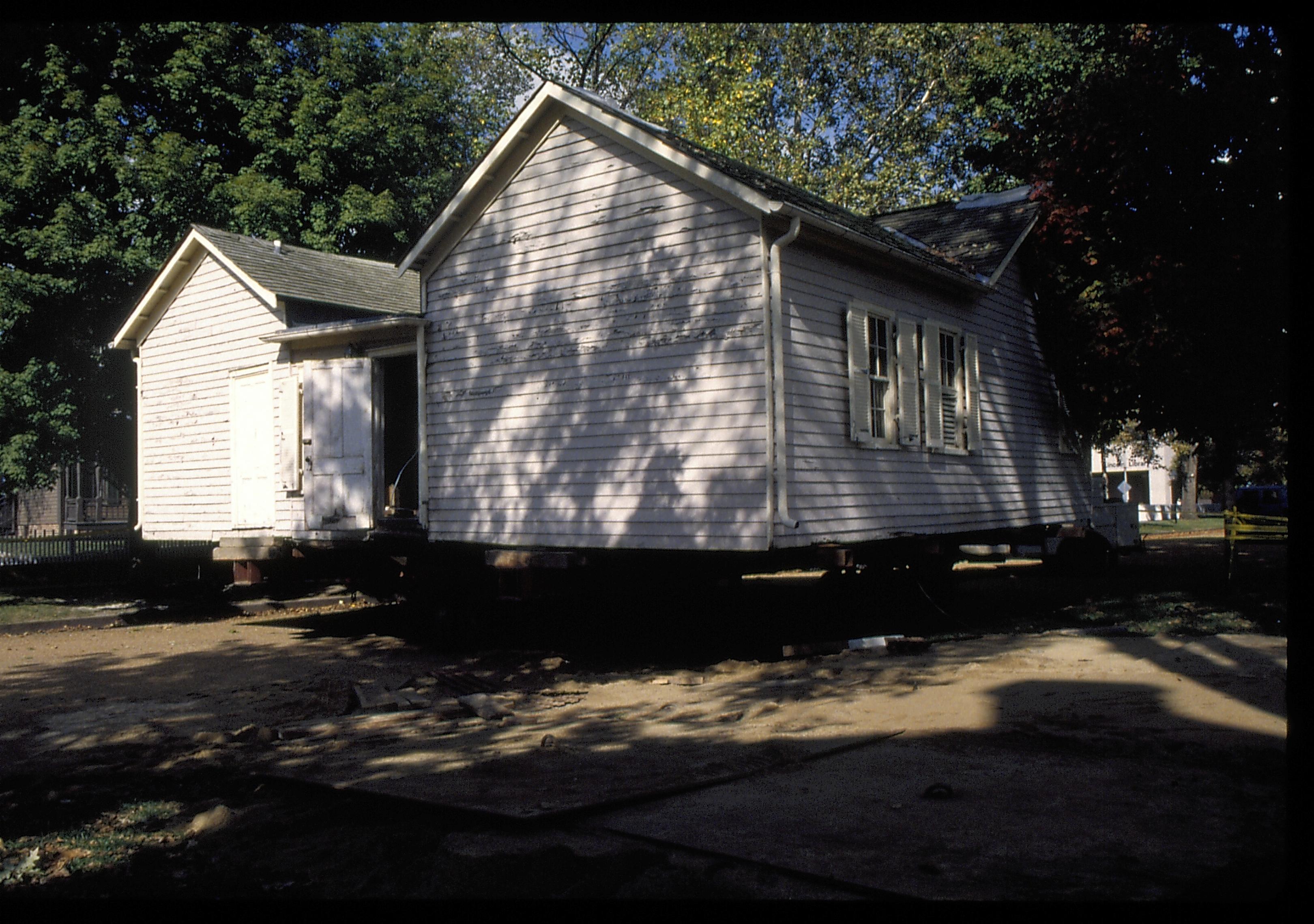 Corneau on street from former location Lincoln Home NHS- Corneau House move, Roll #1 color slides, exp 31 Corneau House, move