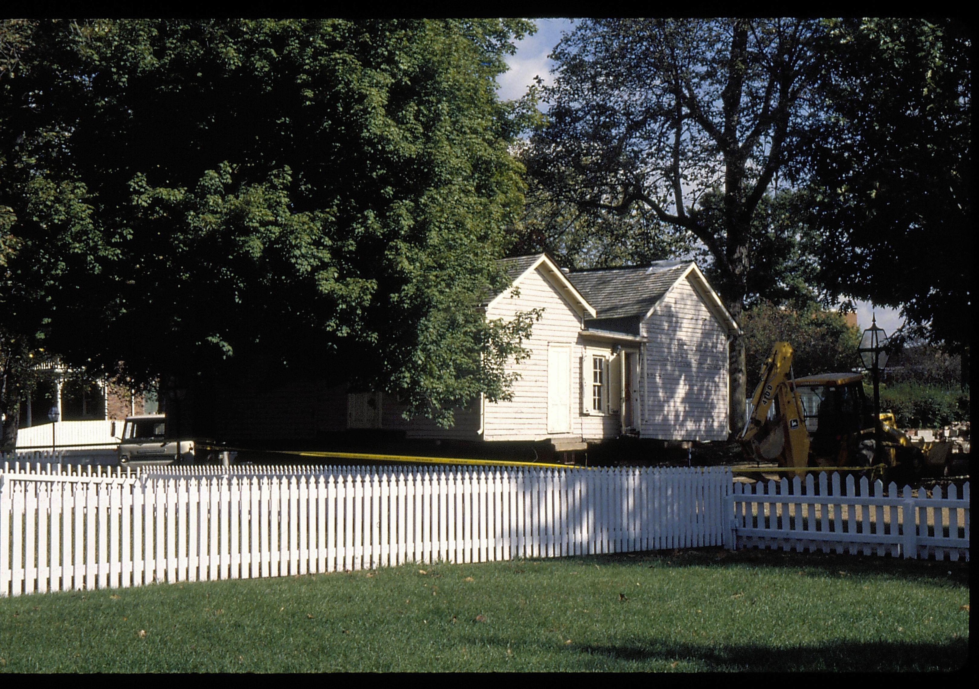 Corneau on street from former location Lincoln Home NHS- Corneau House move, Roll #1 color slides, exp 32 Corneau House, move