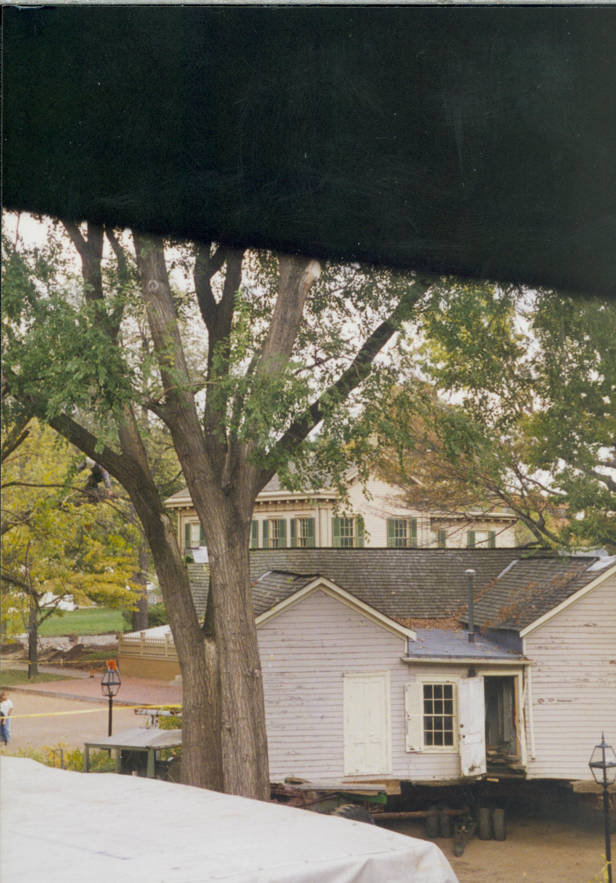 Corneau House move; moving onto b16/lot 16, with Lincoln Home in background (photo taken from 2nd floor of Miller House) Lincoln Home NHS- Corneau House move, exp 29 Corneau House, move