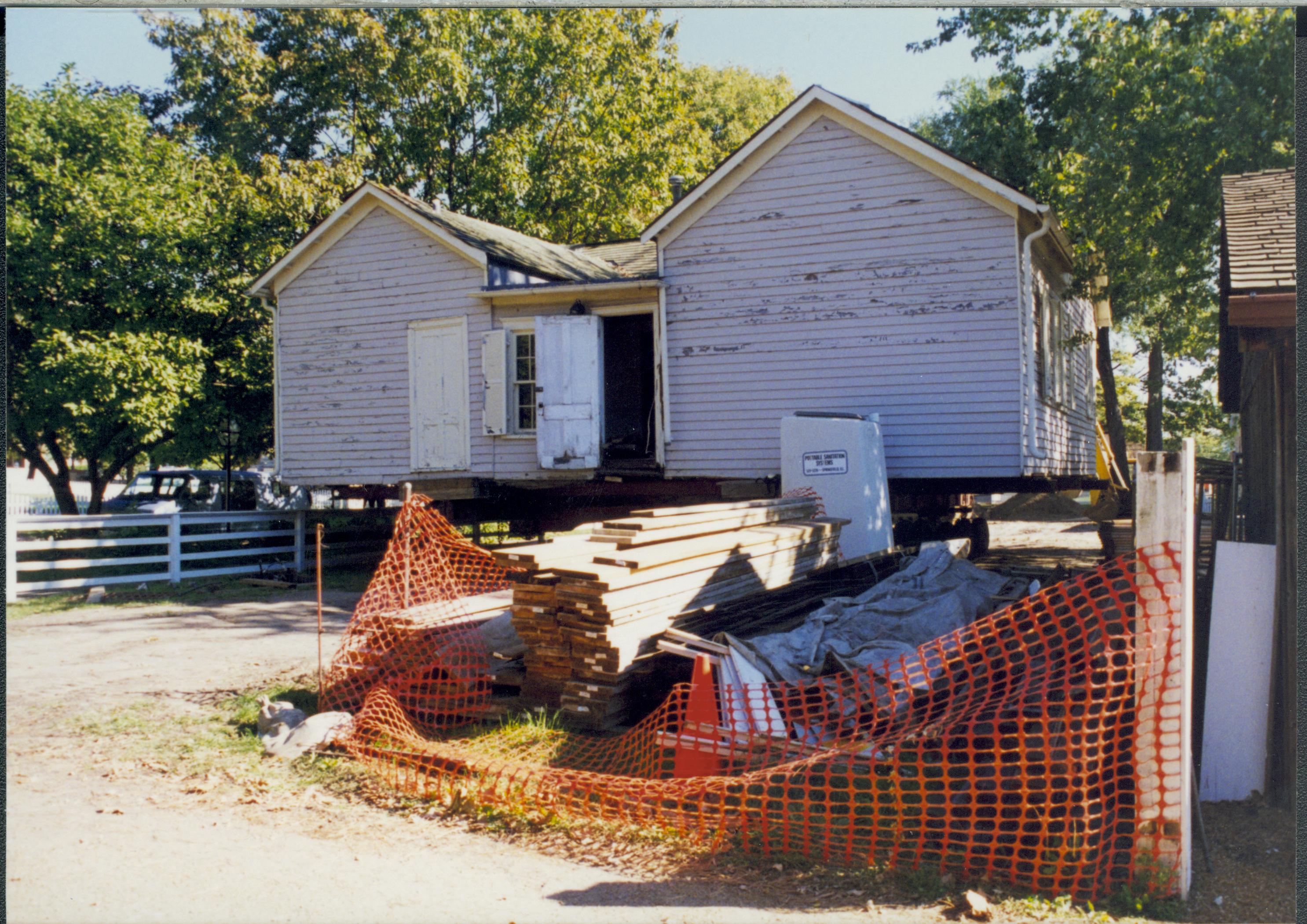 Corneau House move, Corneau House at back of lot (from rear) Lincoln Home NHS- Corneau House move, exp 13, negatives with Roll 5 Colloquium 1997 color Corneau House, move