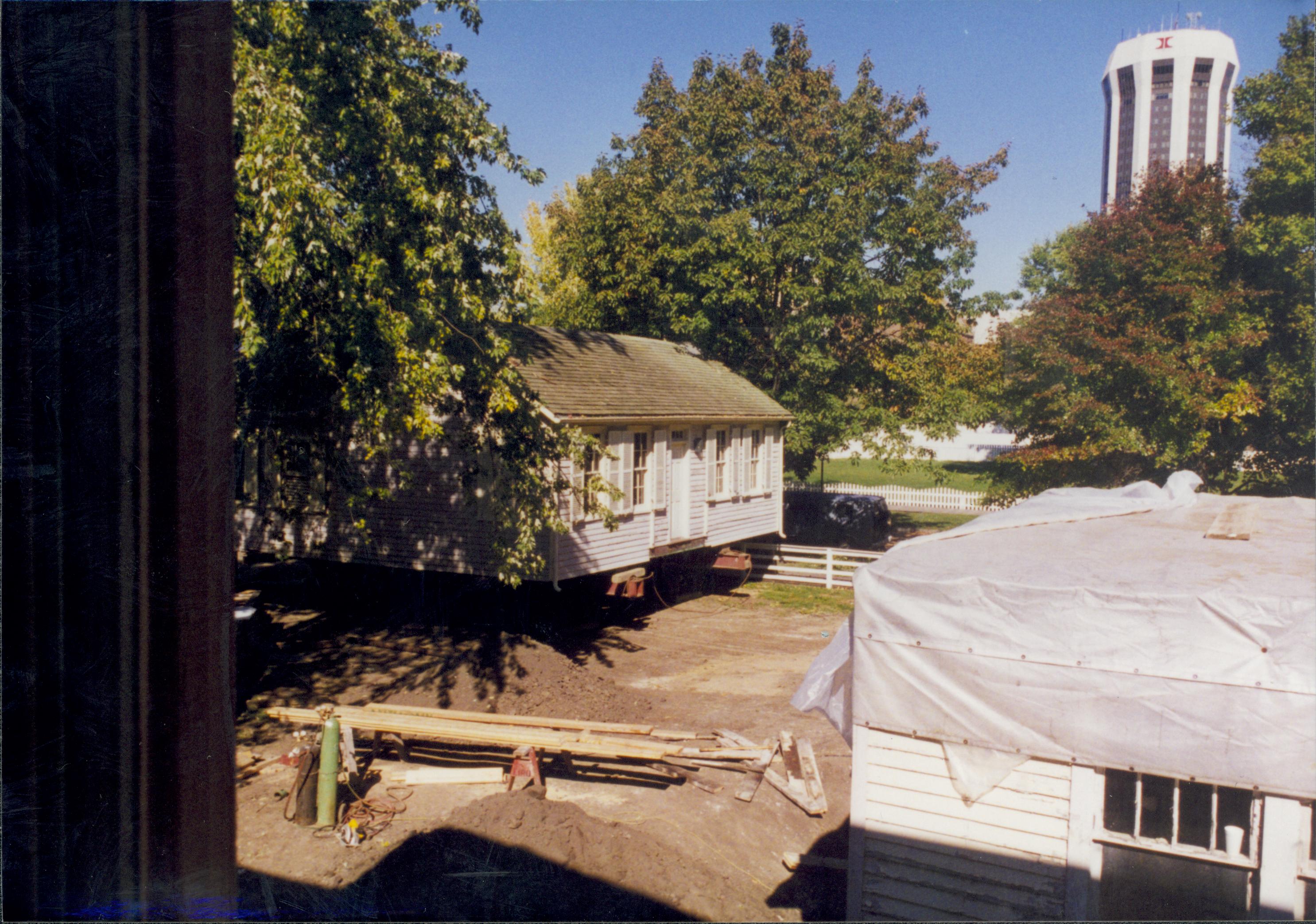 Corneau House move, Corneau House at back of lot (from rear) from Miller House Lincoln Home NHS- Corneau House move, exp 14, negatives with Roll 5 Colloquium 1997 color Corneau House, move