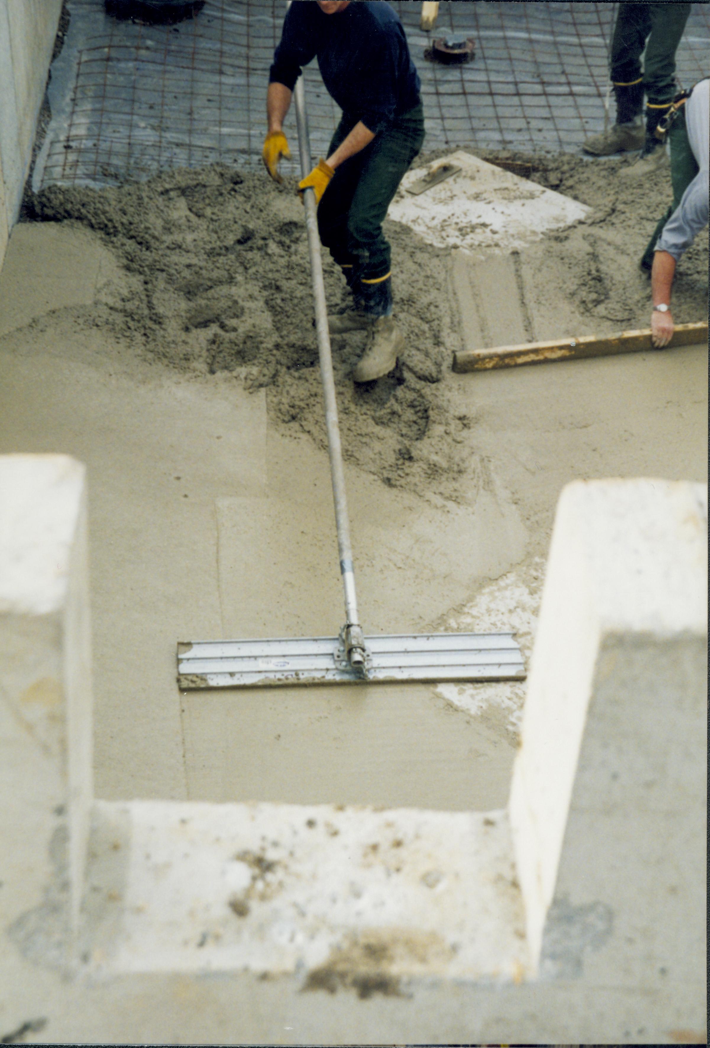 Corneau House move, smoothing concrete Lincoln Home NHS- Corneau House move, Corneau roll #3-photo, exp 22 Corneau House, move