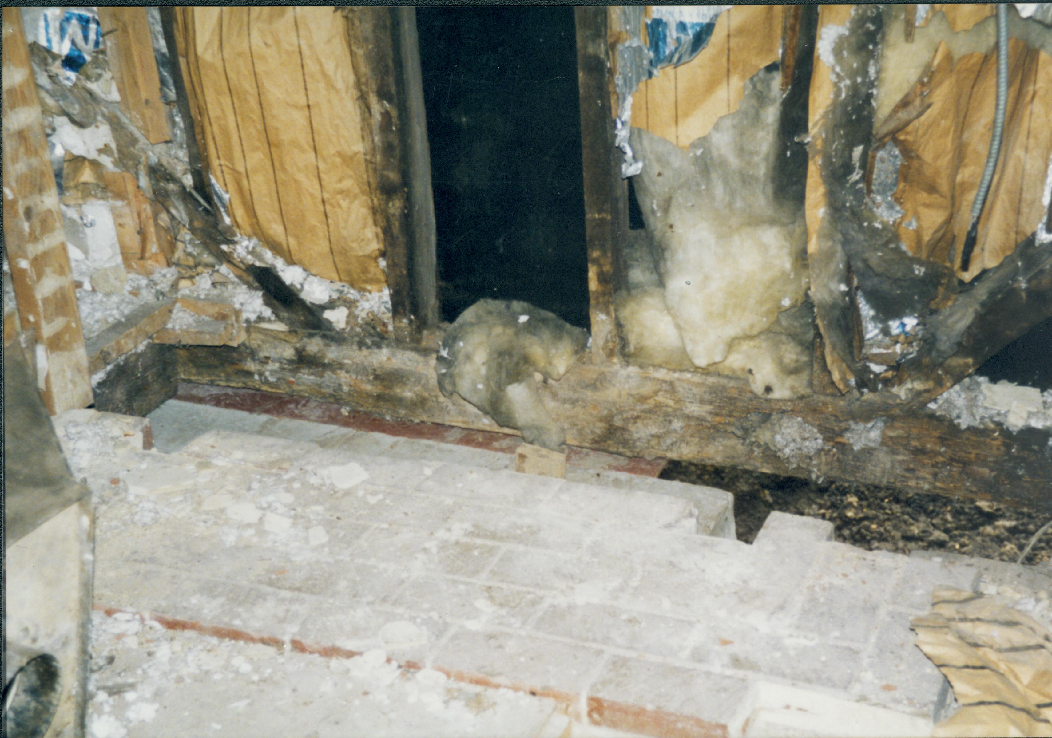 West wall; Southwest corner visible at left. Note architectural features, especially of baseboards. At right, on baseboard, see angled cut-fireplace Lincoln Home NHS- Corneau House Restoration, roll N4 exp 14 Corneau House, restoration, trap door