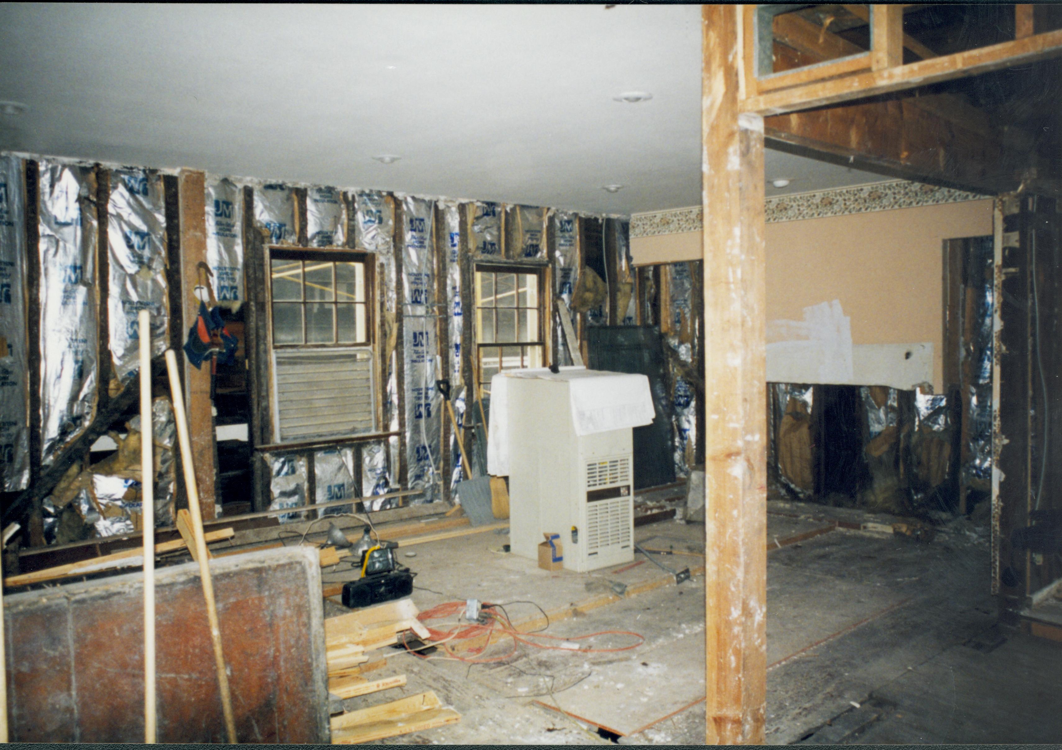 Southwest interior corner of house; two windows on South wall. Photo taken while standing in exactly the same location at number 22 (below) Lincoln Home NHS- Corneau House Restoration, roll N4 exp 21 Corneau House, restoration