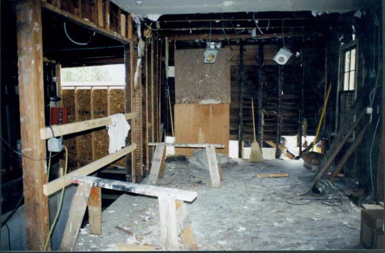 Looking towards West wall. North entrance door (not visible) at right of photo; basement entrance at left (can see stairs running down) Lincoln Home NHS- Corneau House Restoration, roll N6 exp 7 Corneau House, restoration