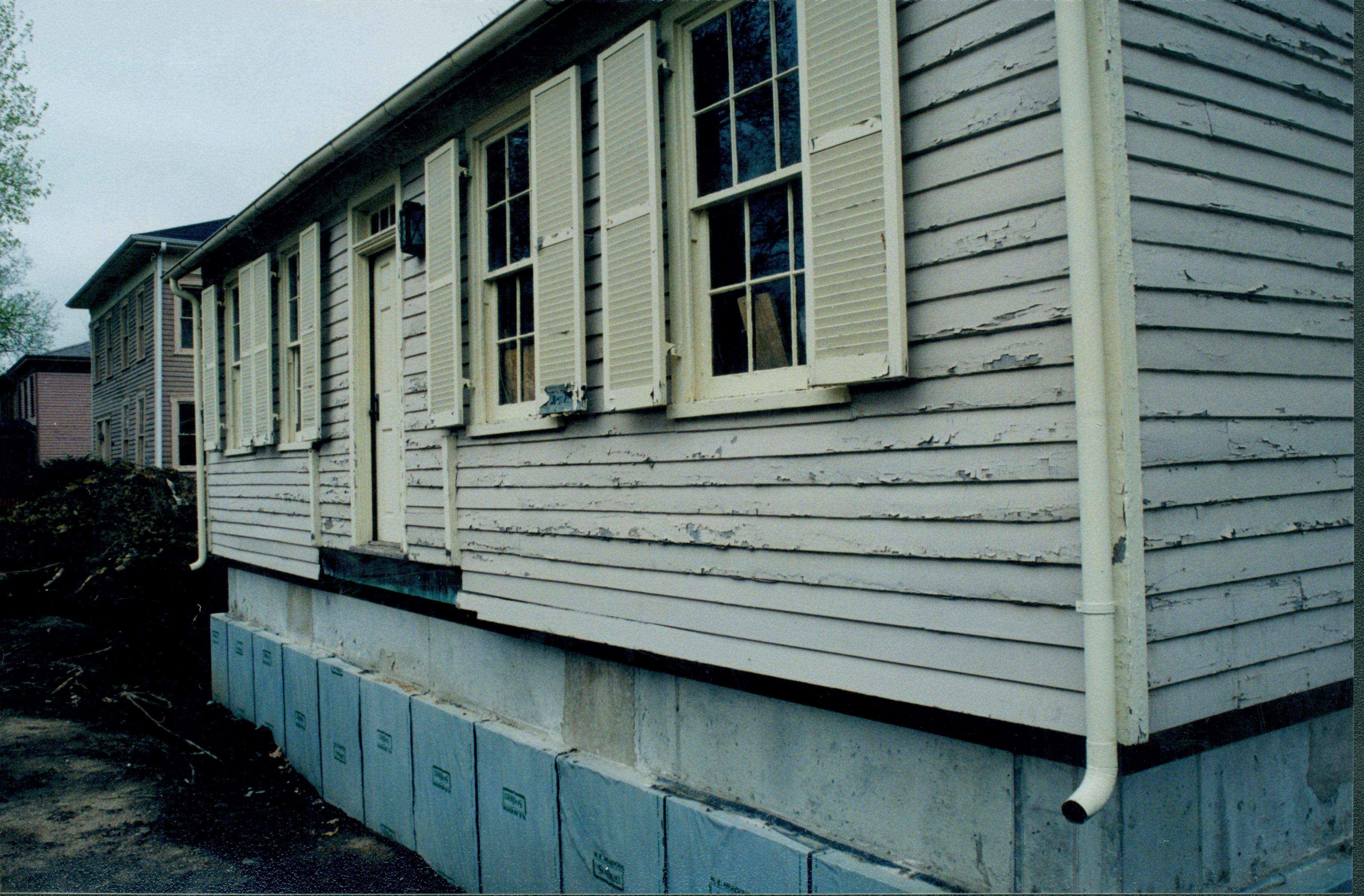 Photo taken looking South along East external wall; Northeast corner at right of photo, Foundation (pre-brick) clearly seen at bottom of photo Lincoln Home NHS- Corneau House Restoration, roll N6 exp 9 Corneau House, restoration
