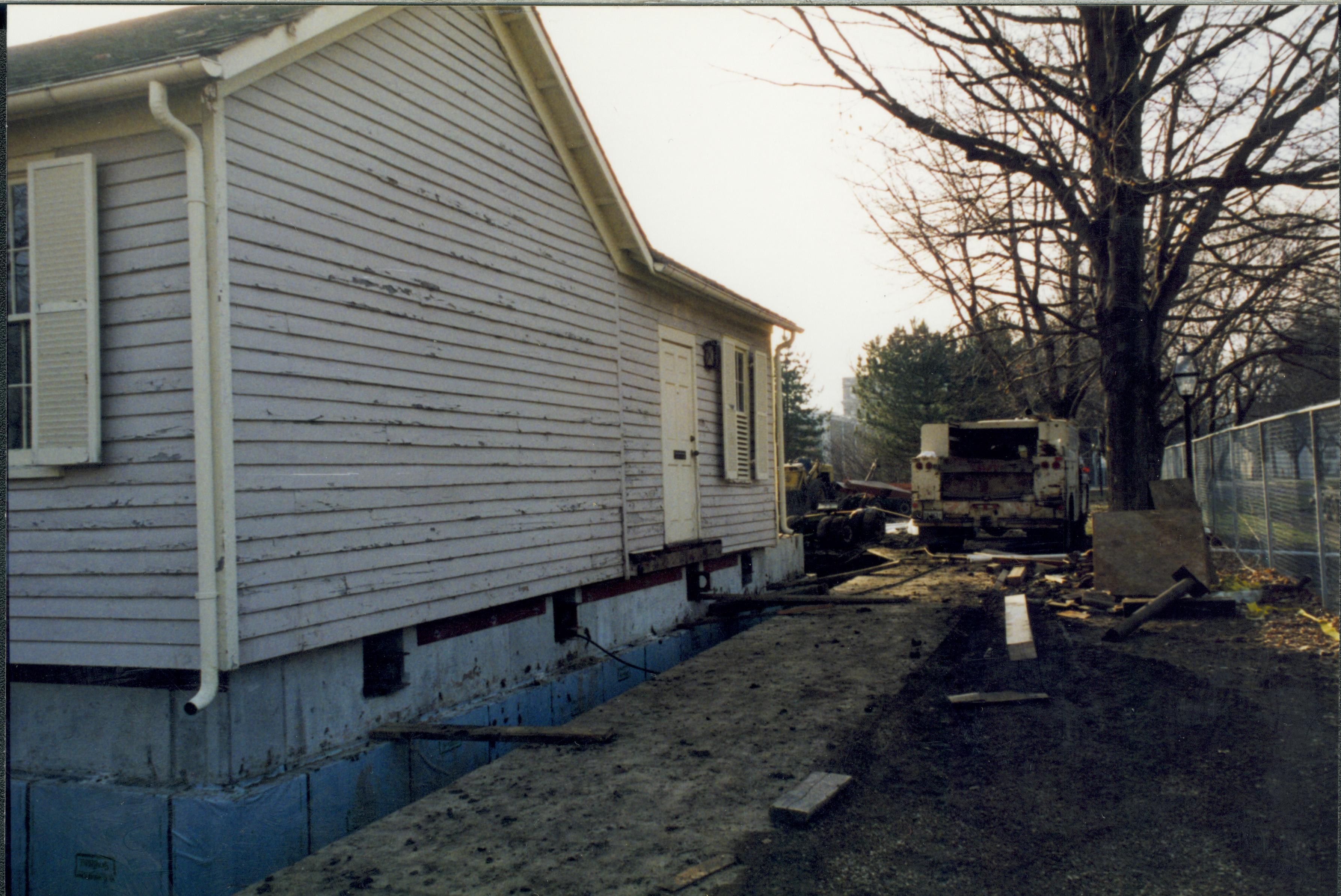 House immediately after lowered onto new foundation; Northeast corner visible Lincoln Home NHS- Corneau House Restoration, roll N1 exp 2 Corneau House, restoration