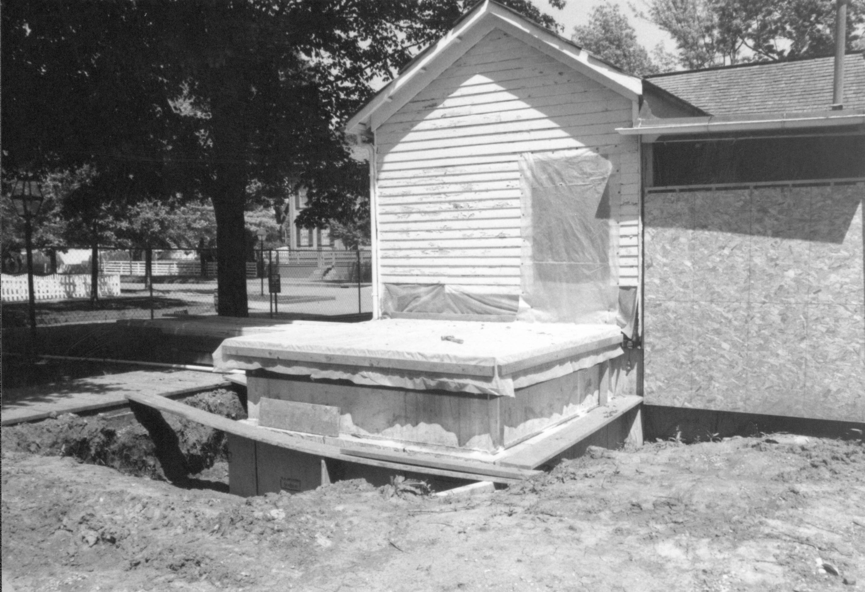 Floor/foundation of West room (addition). West wall of house visible Lincoln Home NHS- Corneau House Restoration, roll N12 exp 8 Corneau House, excavation