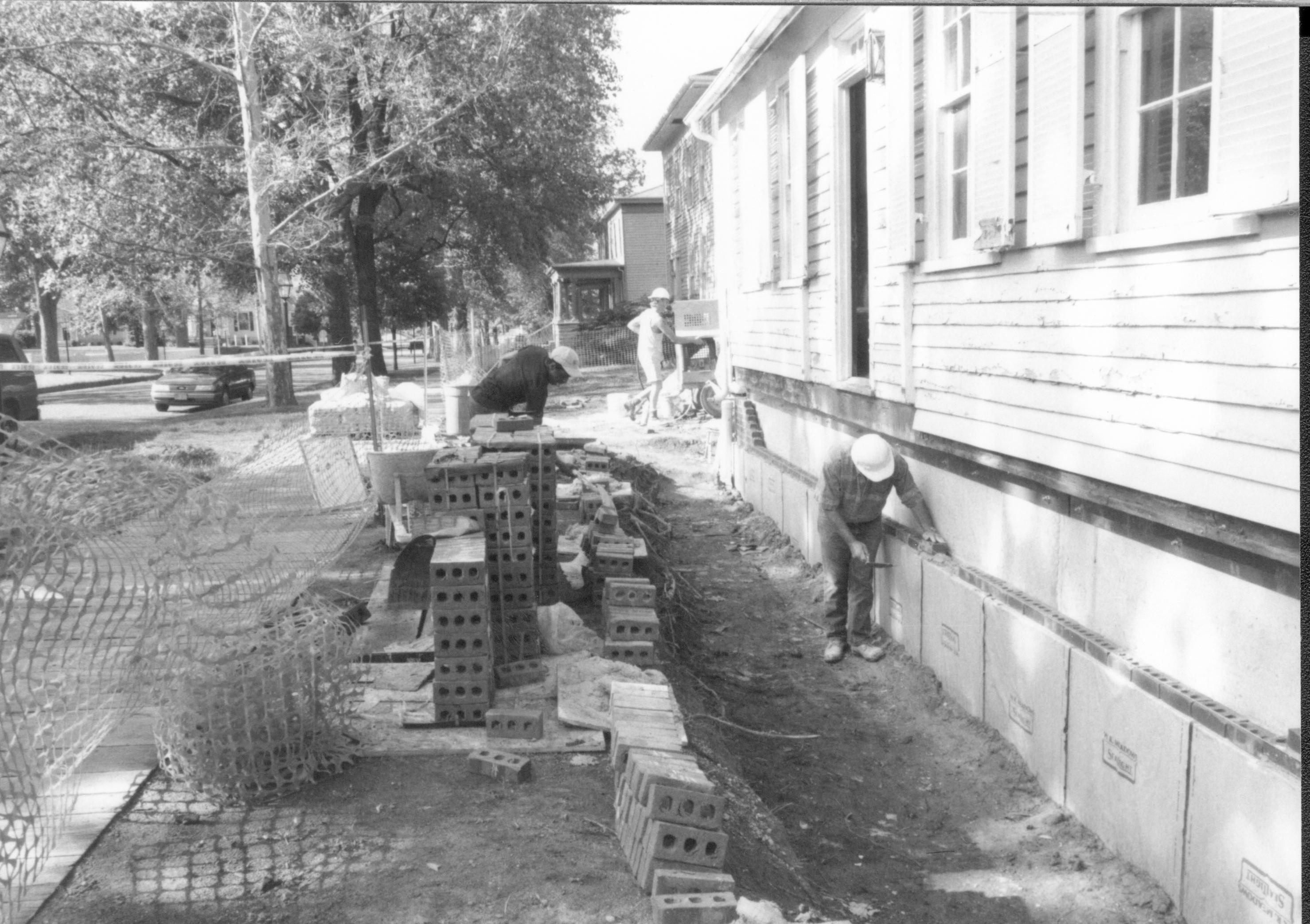 Details of bricks being laid around foundation. Photo taken at Northeast corner of house, looking South along East wall Lincoln Home NHS- Corneau House Restoration, roll N12 exp 18 Corneau House, excavation