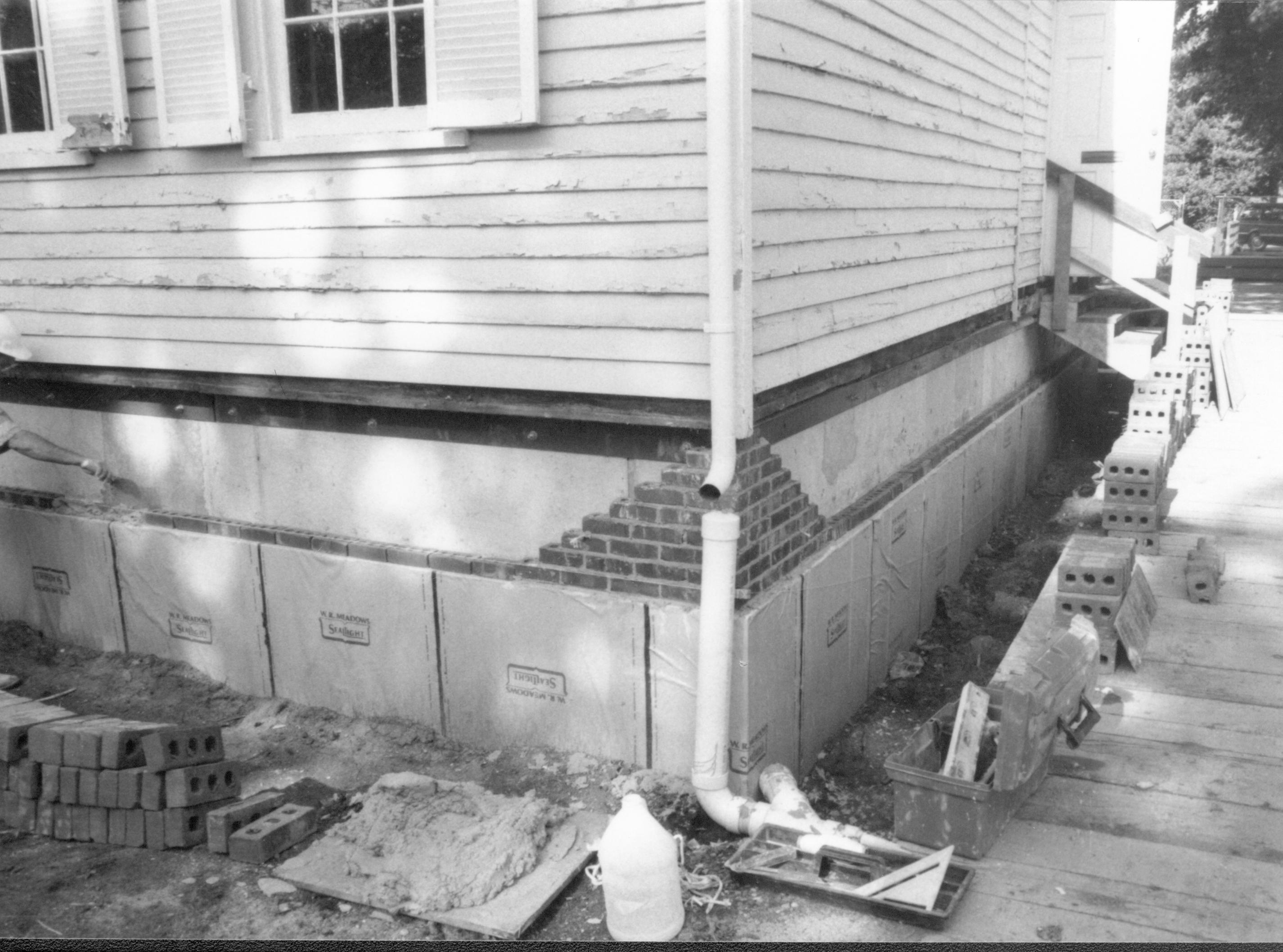 Details of bricks being laid around foundation. Photo taken at Northeast corner of house, looking South along East wall Lincoln Home NHS- Corneau House Restoration, roll N12 exp 21 Corneau House, excavation