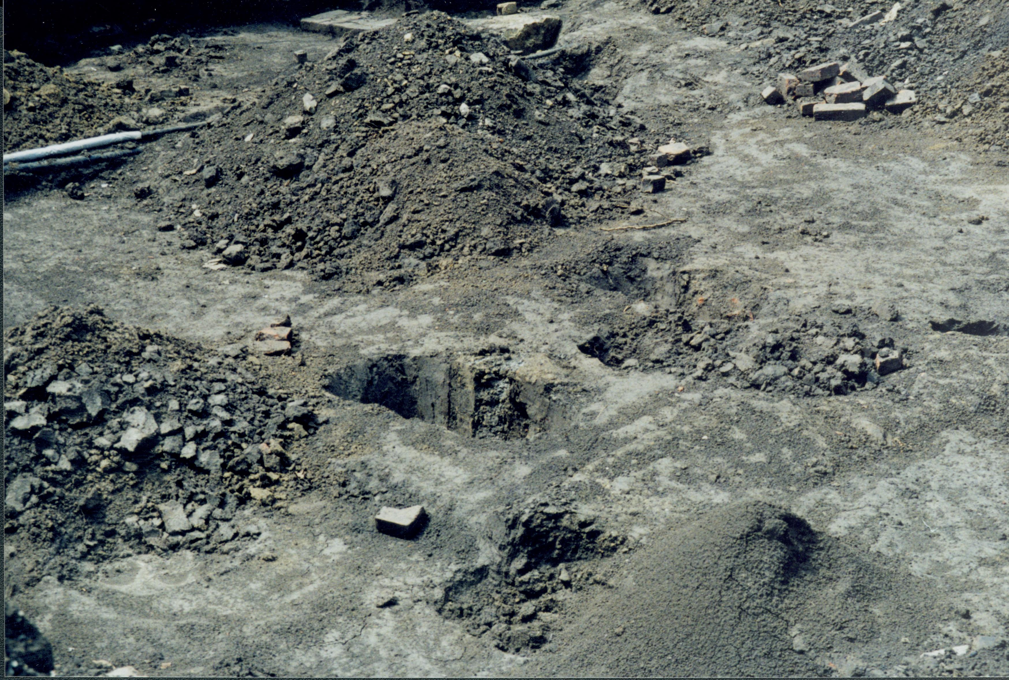 Excavations on West end of Corneau lot. Pit features backfill, etc. at West of excavation trench Lincoln Home NHS- Corneau House Restoration, roll N8 exp 11 Corneau House, excavation