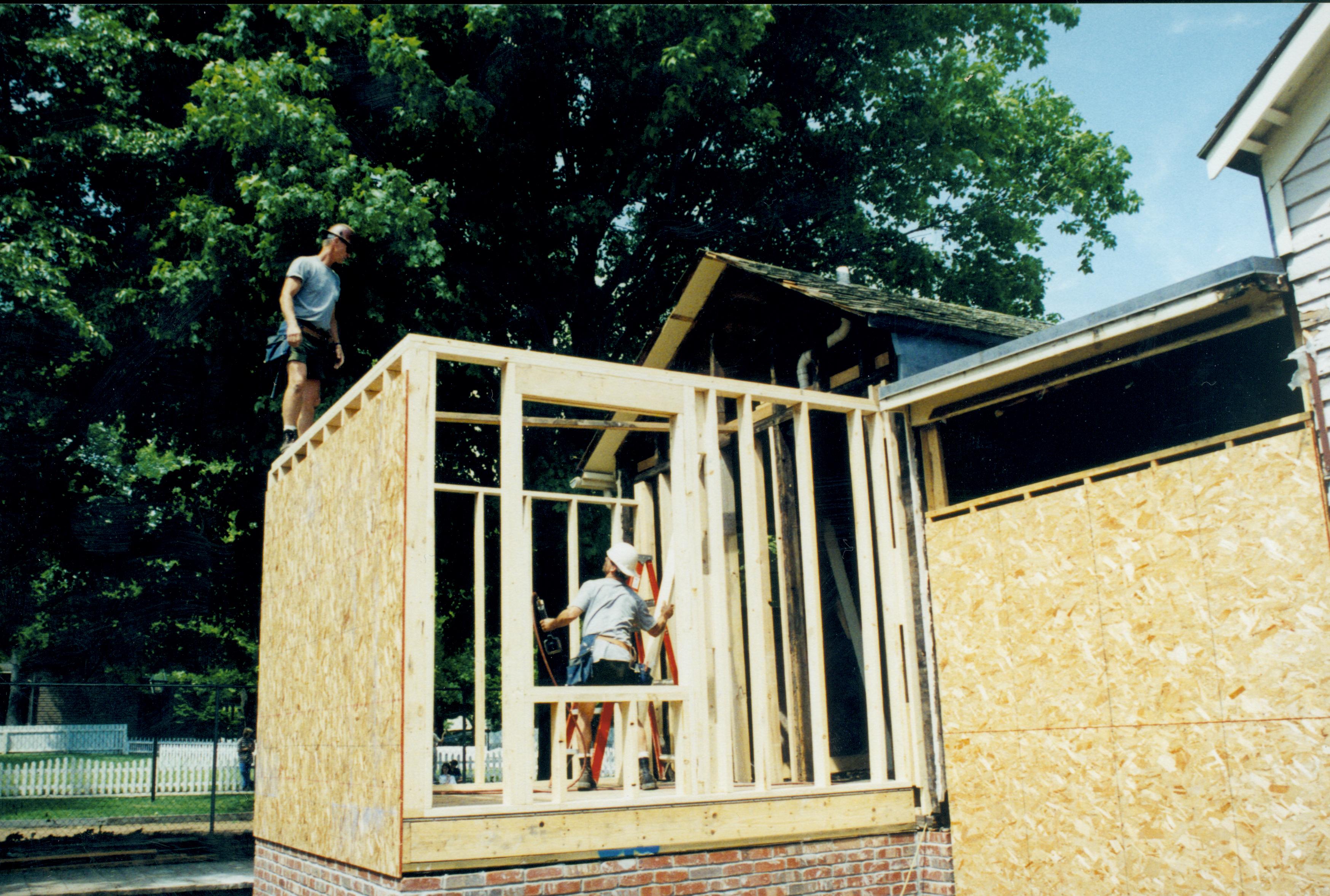 South and West wall and foundations of room 105. Plywood on West wall, South studs (north in background) in place Lincoln Home NHS- Corneau House Restoration, roll N8 exp 14 Corneau House, renovation