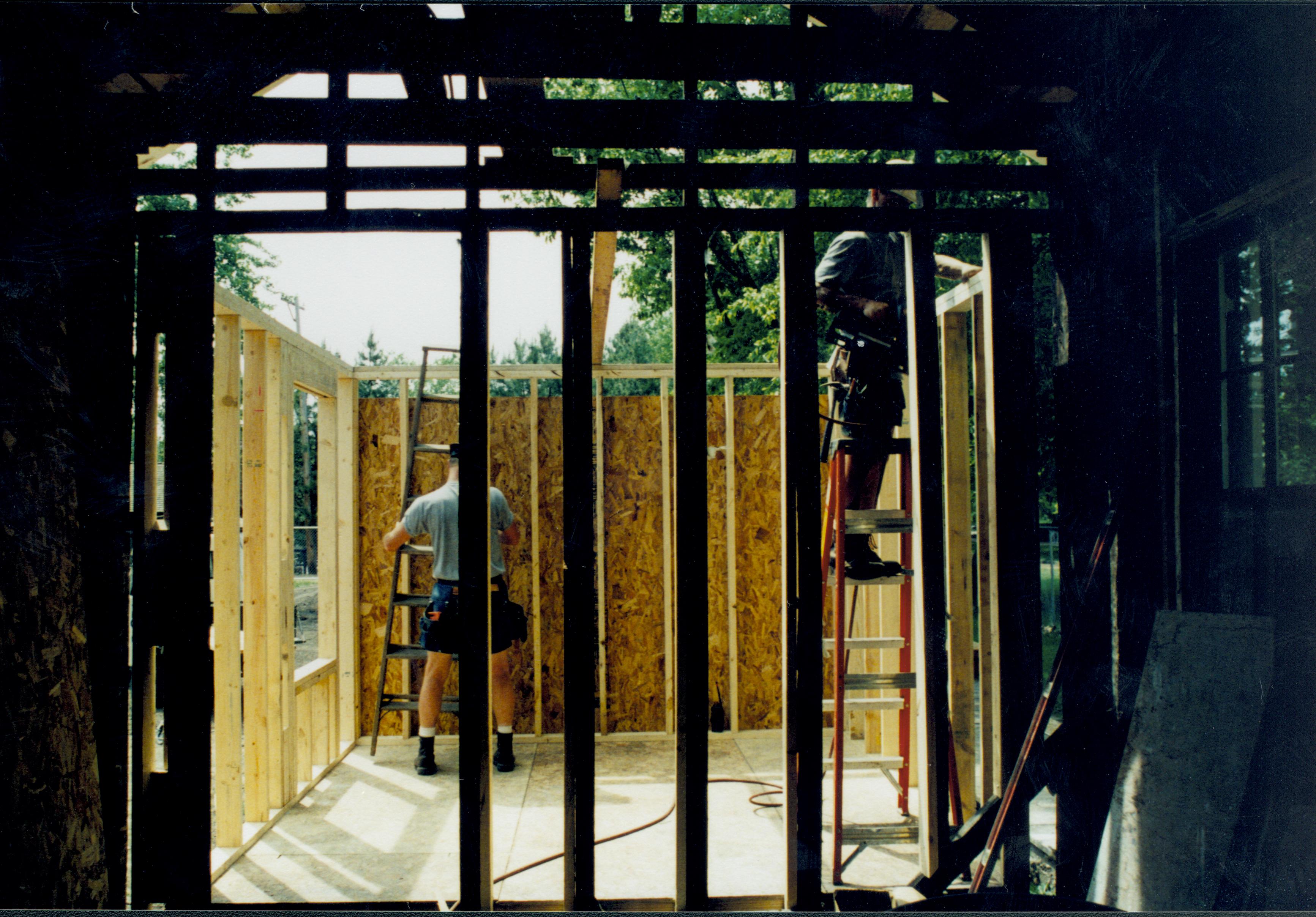 Looking West from room 104, ito room 105 (East wall in foreground). Wall studs and joists in place. Photo taken facing West Lincoln Home NHS- Corneau House Restoration, roll N8 exp 15 Corneau House, renovation