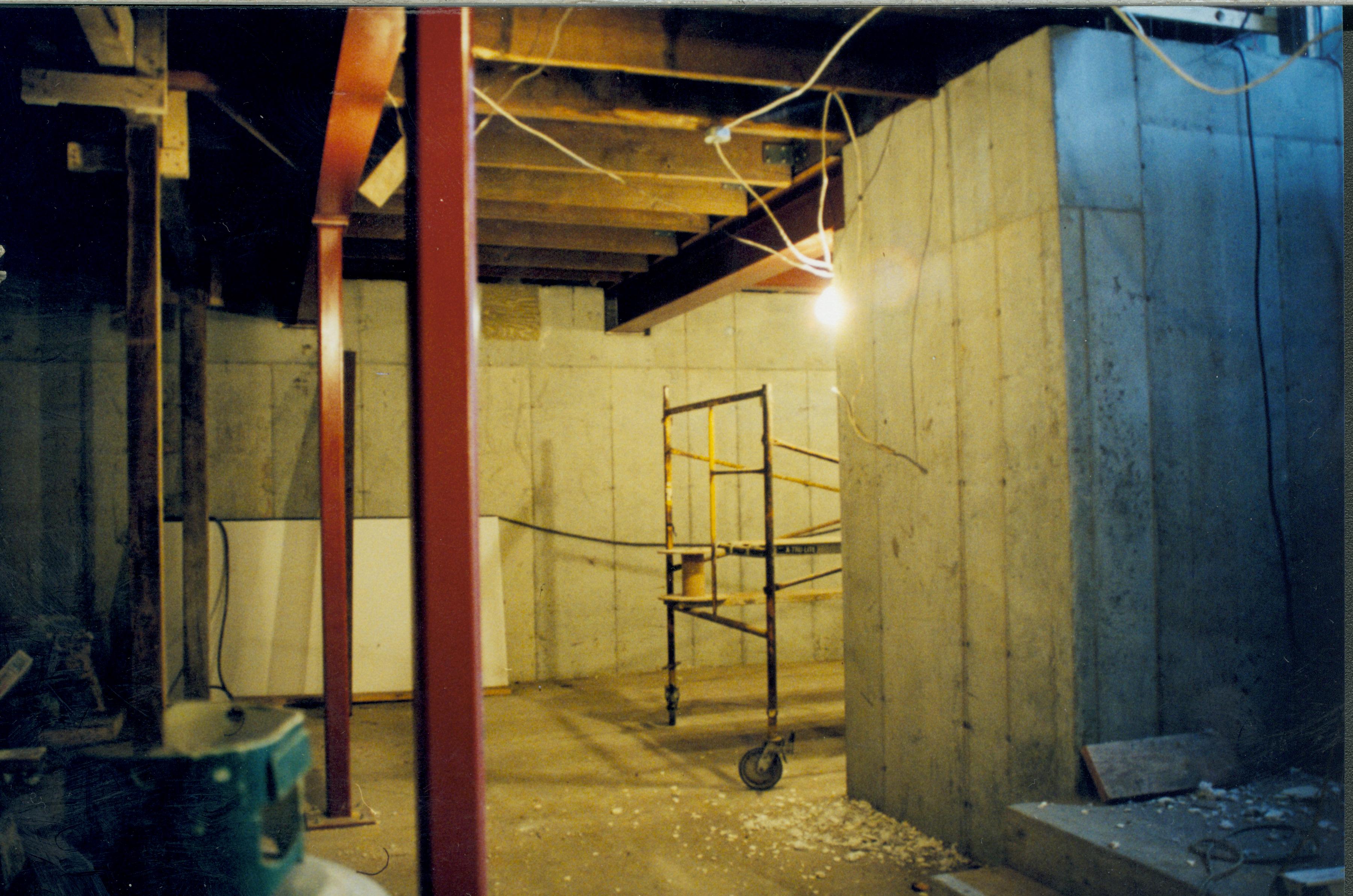 basement; Looking at South wall and details at West side of room. Floor joists supports for first floor visible at top Left corner of photo. Staircase/entry to basement at right/lower right of photo Lincoln Home NHS- Corneau House Restoration, roll N6 exp 2 Corneau House, restoration