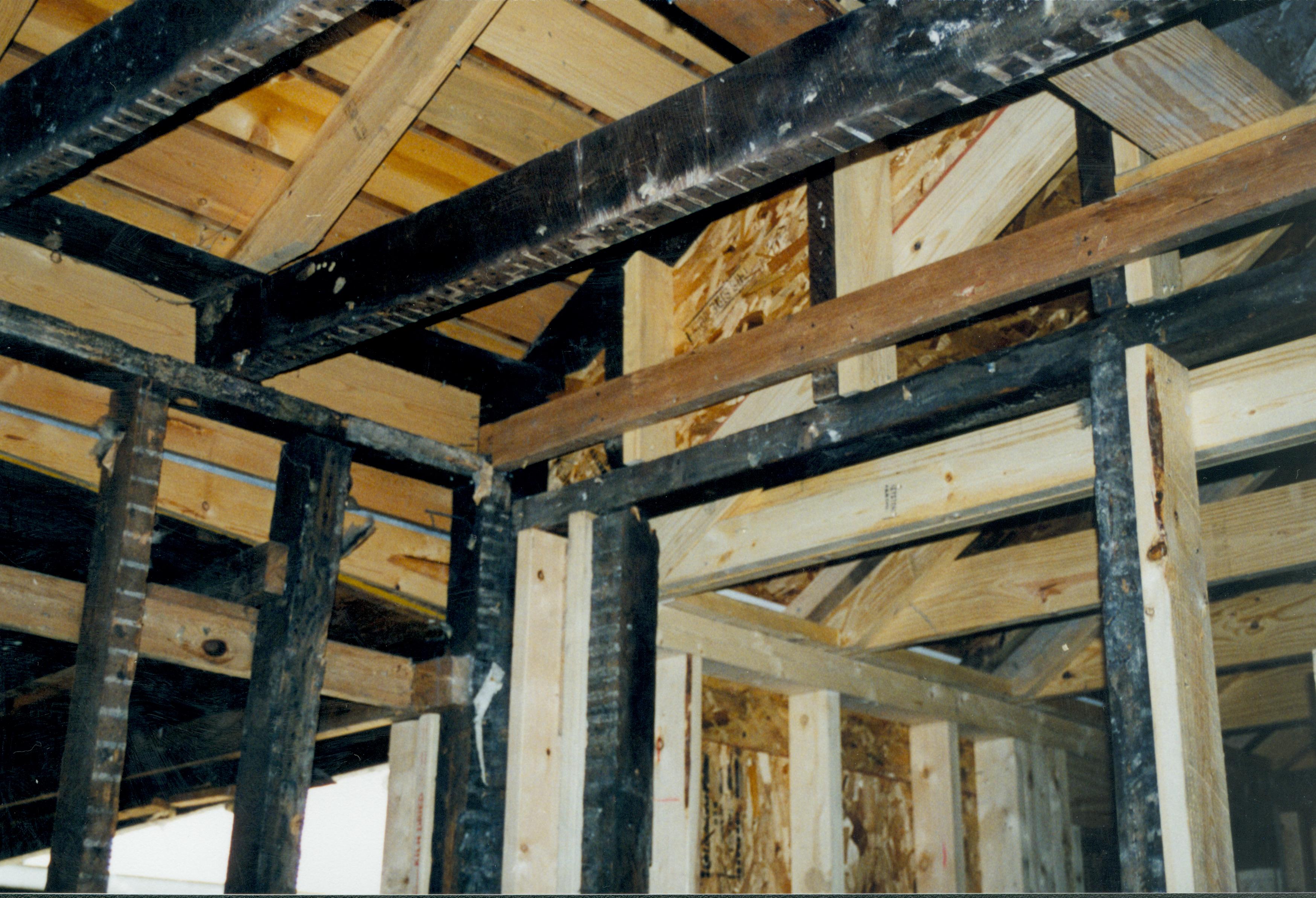 Photo taken looking Northwest, from room 104 into room 105 (addition). Detail of roof (joists, frames, rafters, etc.) and Southwest corner of room 104 Lincoln Home NHS- Corneau House Restoration, roll N9 exp 10 Corneau House, restoration