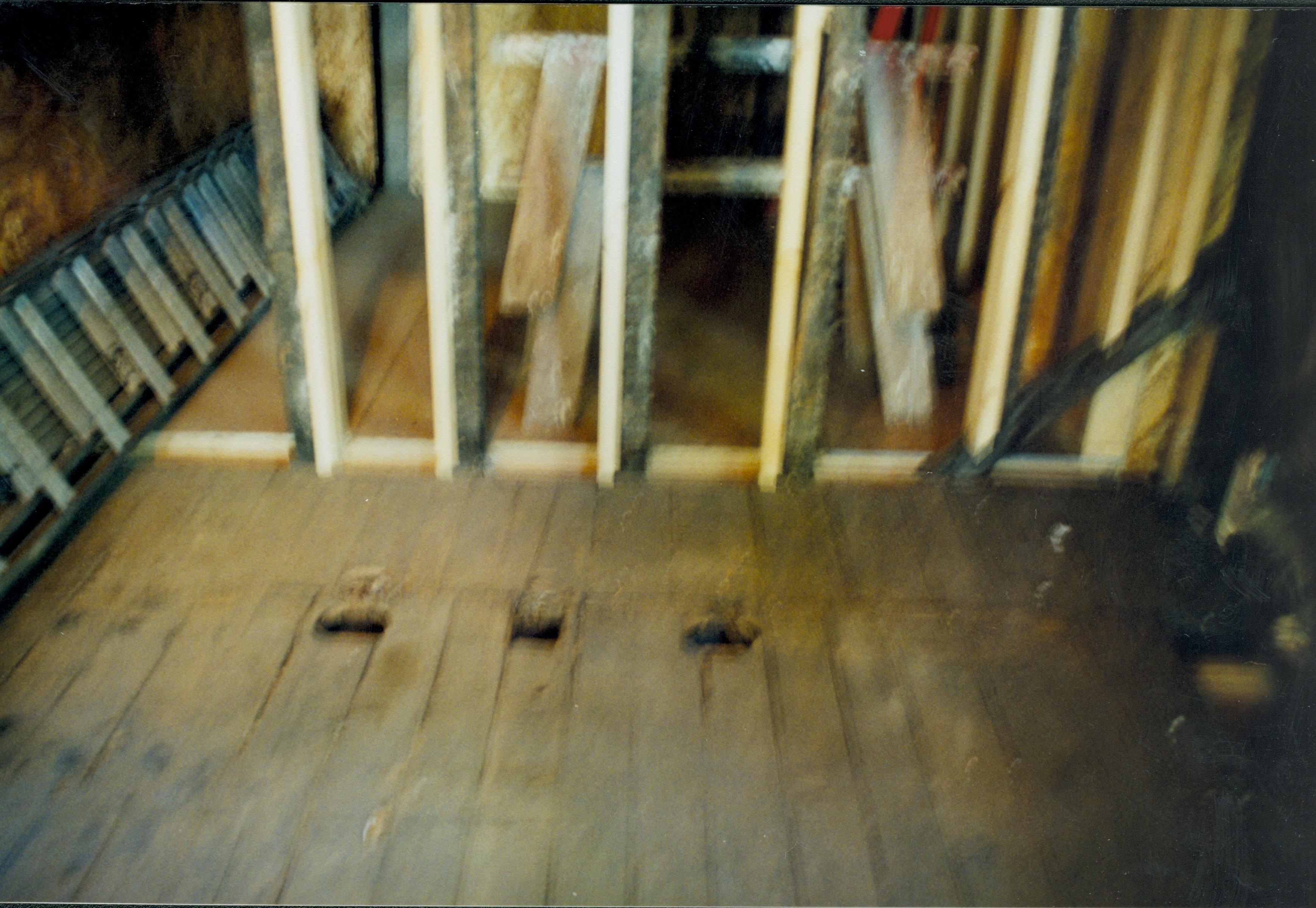 Blurry. Photo taken looking West, from room 104 into room 105 (addition). Detail of floor and studs Lincoln Home NHS- Corneau House Restoration, roll N9 exp 11 Corneau House, restoration