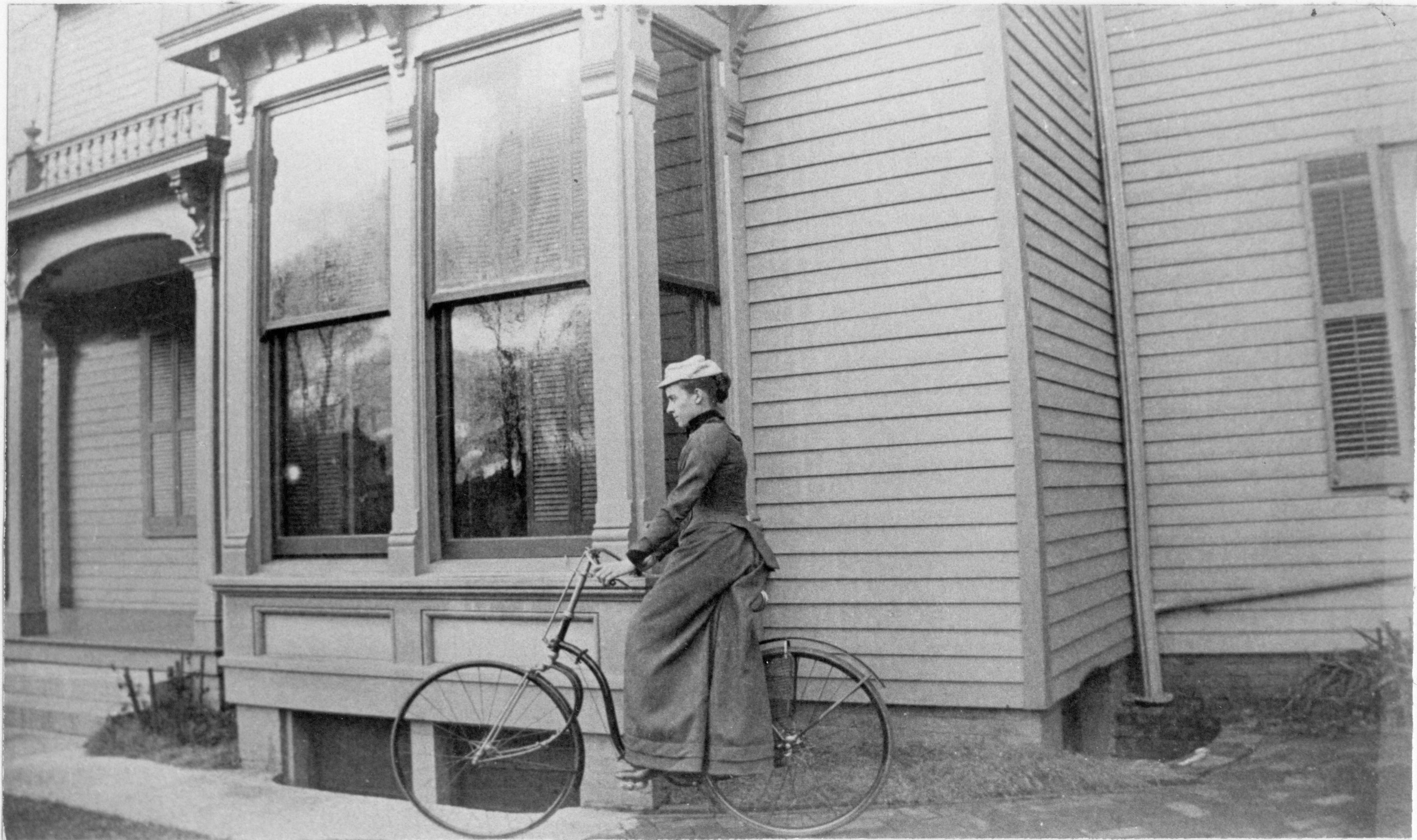 Photo taken shows the two-story bay window at the south wing. Detailed railing on the porch roof. Robinson House, Exterior