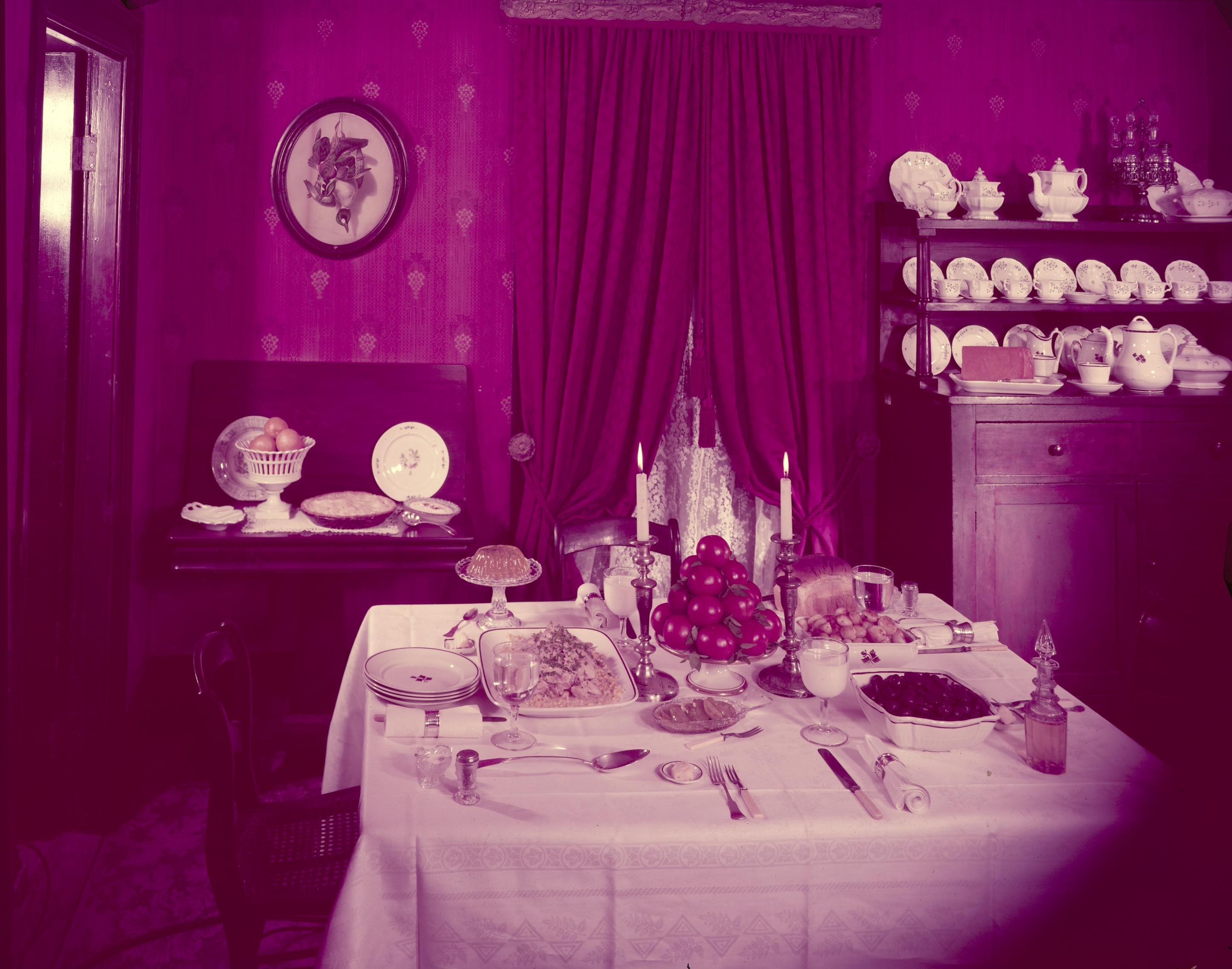 Dining room with table set for a formal meal. Lincoln Home NHS- McCalls pictures 1957, 8-11+, 11 Lincoln, McCalls, dining, furnishings
