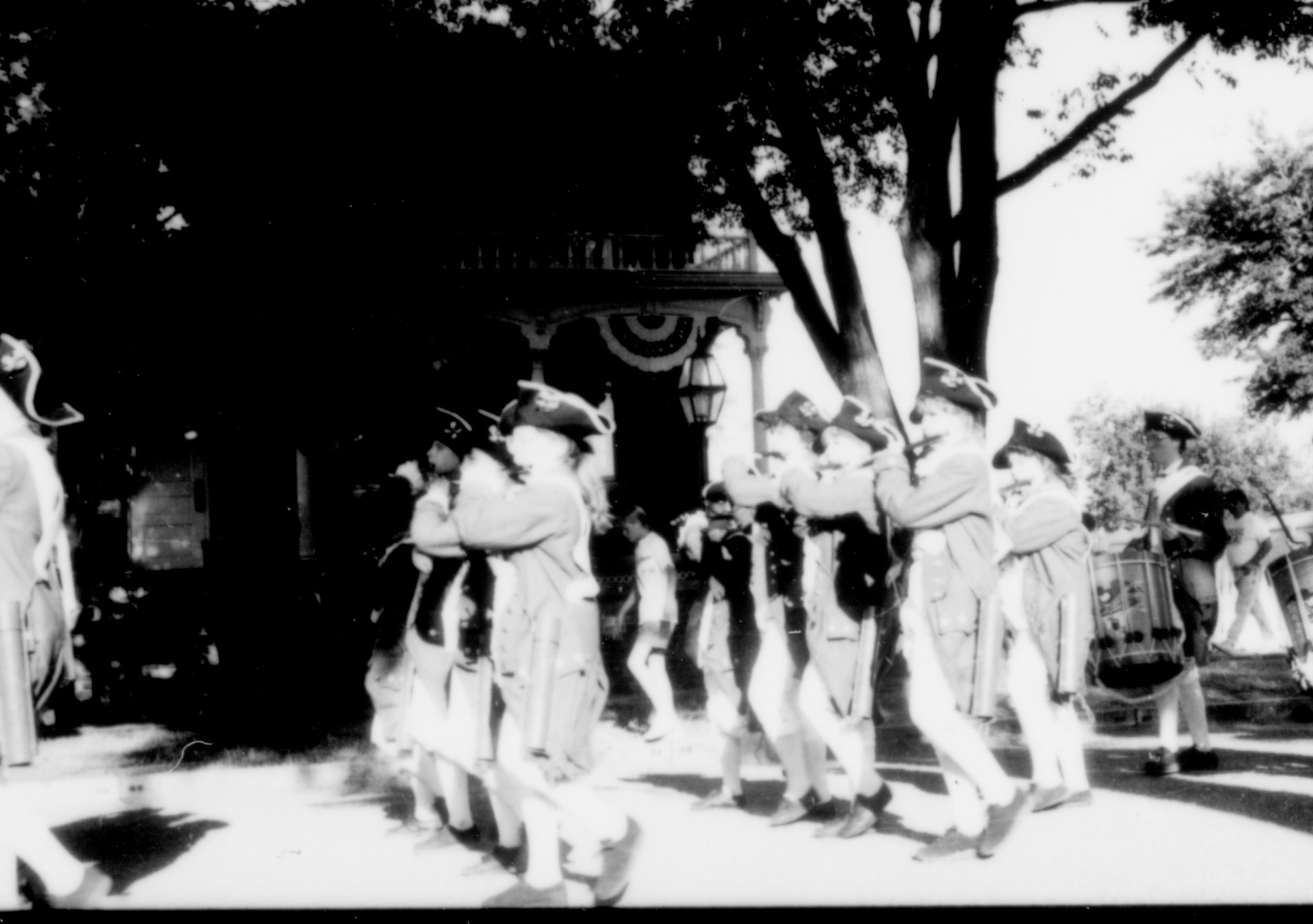 Fife and Drum Corps marching in front of Conference Center of Lincoln Home NHS, during the Lincoln Festival. (69?) Photographer facing east.