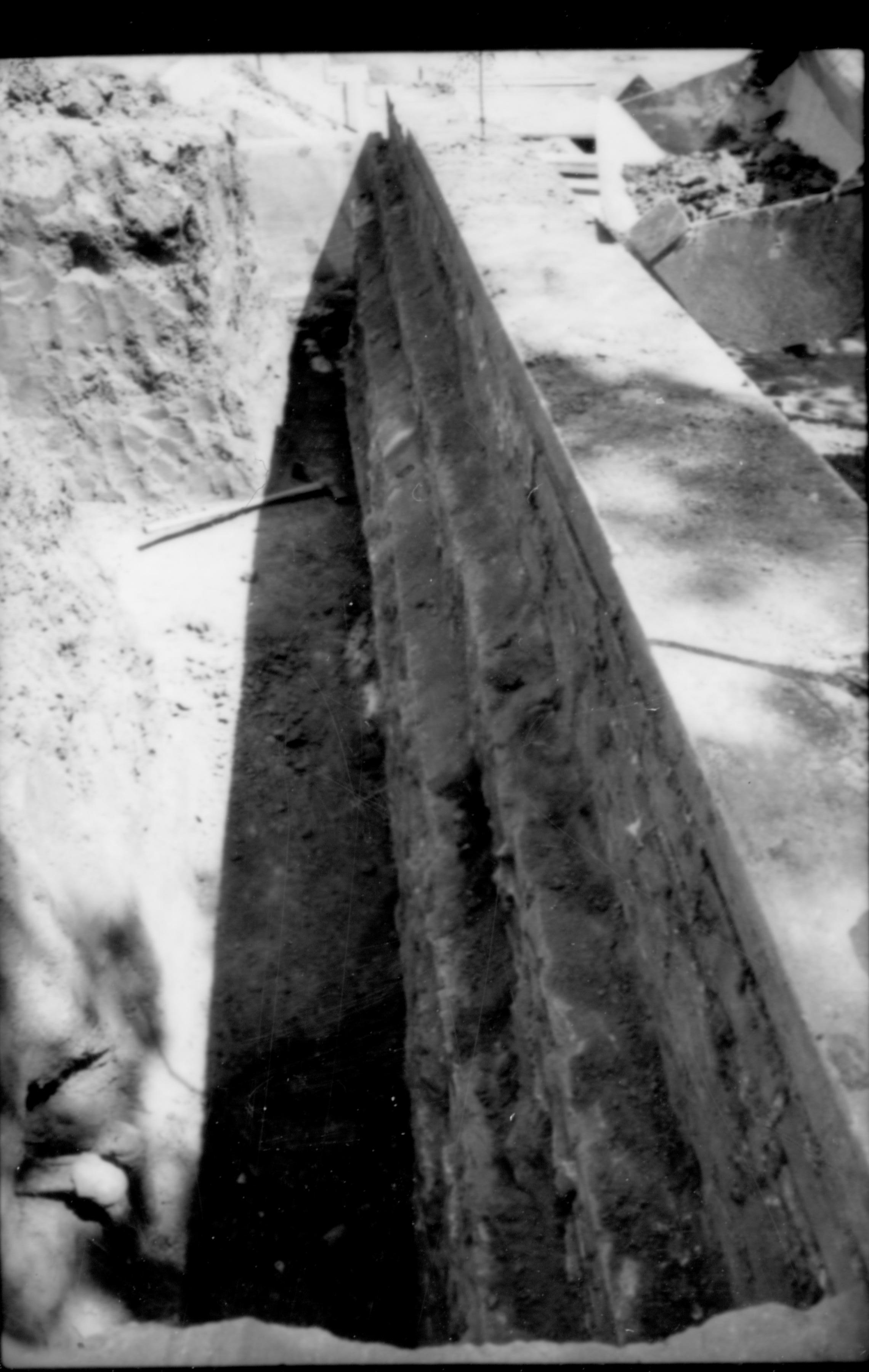 The interior face and cap of the south retaining wall of the Lincoln home. Photograper facing east.