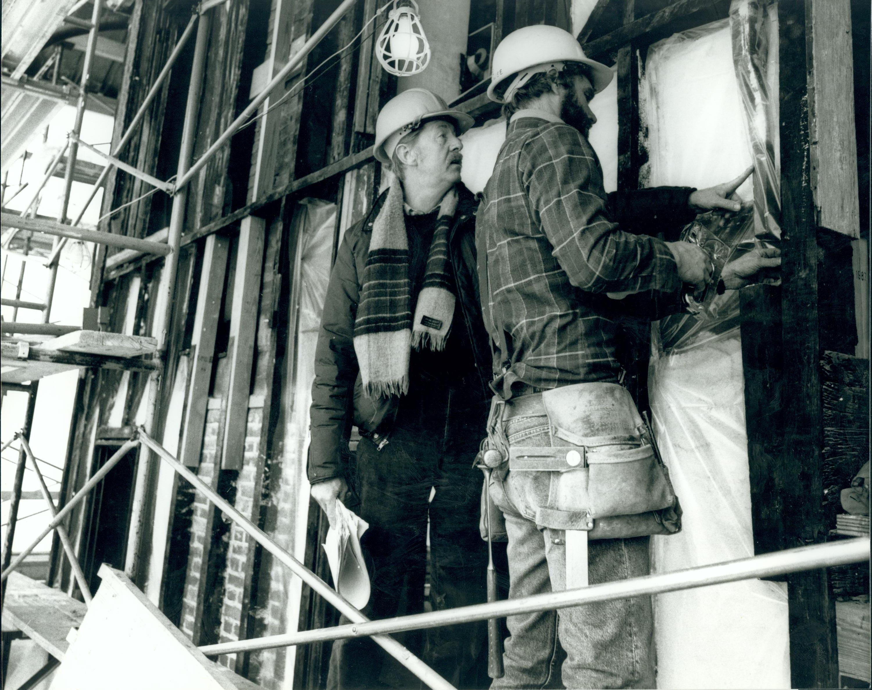 A protective vinyl vapor barrier is being applied to all the exterior walls of Lincoln's Home. Insulation and plywood sheeting will be added before the original house siding is replaced. Architect, Vance Kaminiski, Project Supervisor for the NPS and Joe H Inside Tent - Exterior Walls Lincoln, Home, Restoration, tent, scaffolding