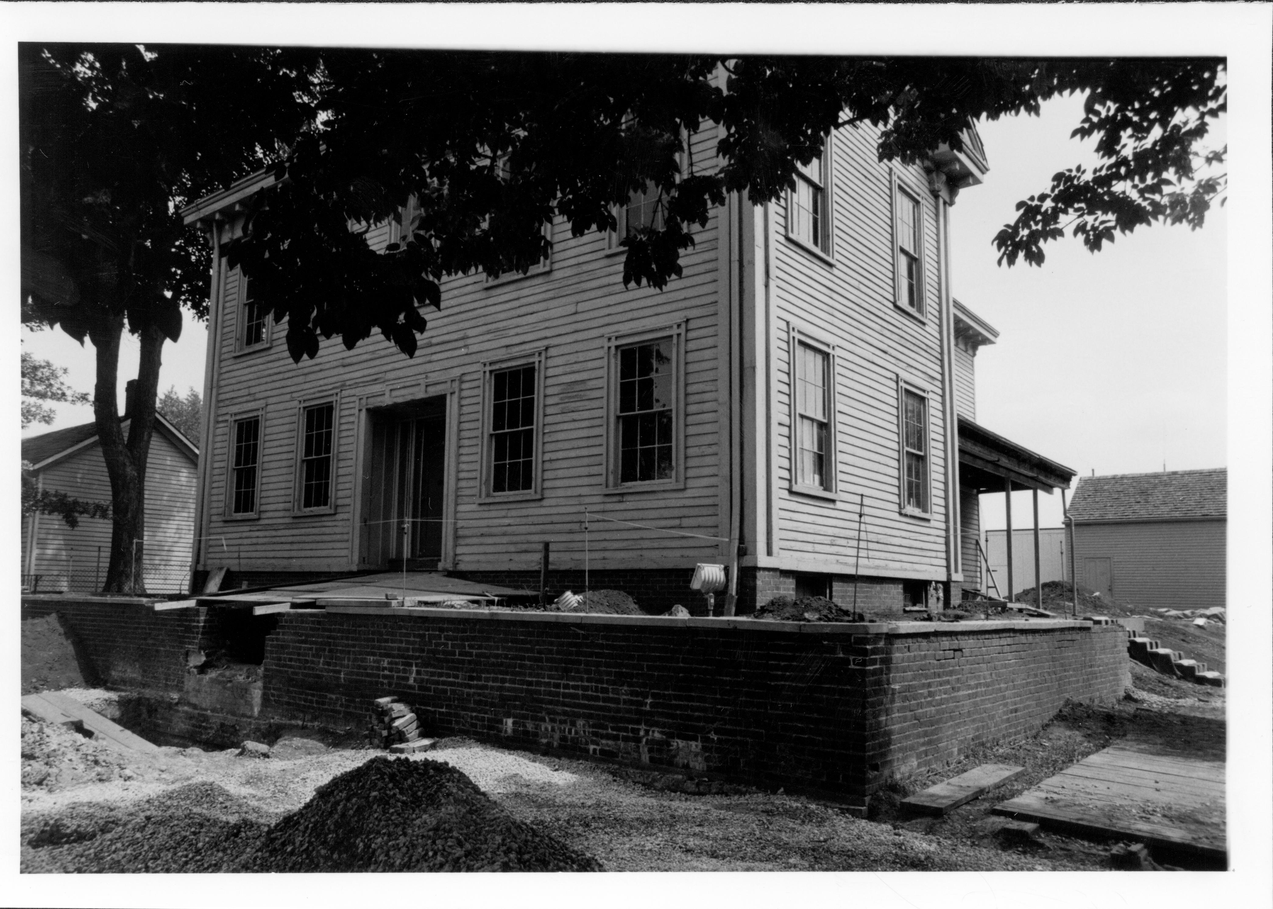 The Lincoln Home as seen from the south west during the 1987-88 restoration. The Corneau house can be seen to the left of the picture.