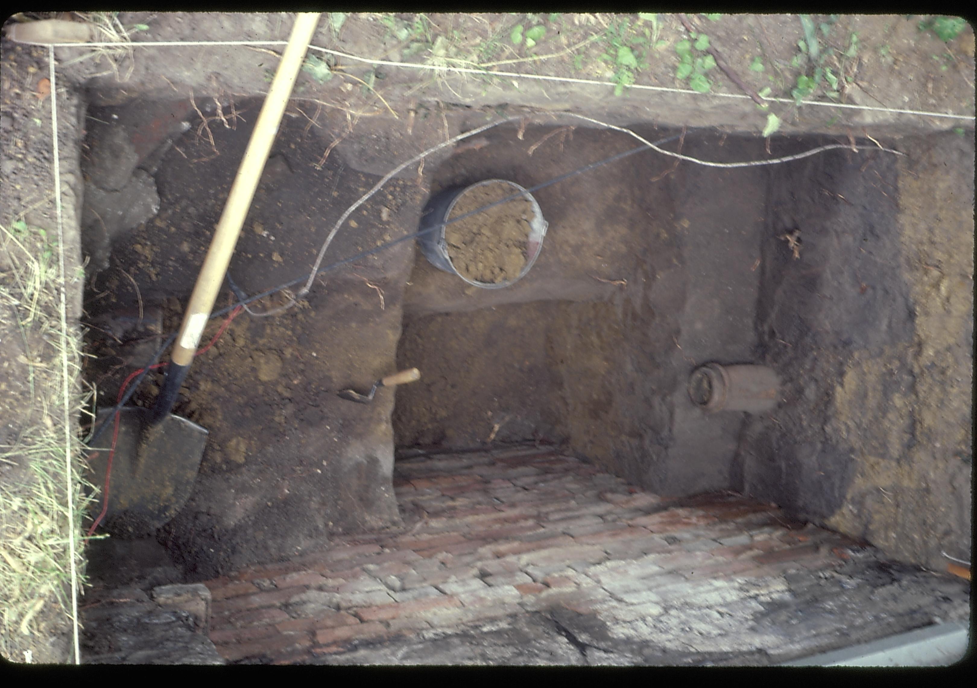 Archeology pit located on the Lincoln Home foundation. A drain tile can be seen on the right side of the photo.