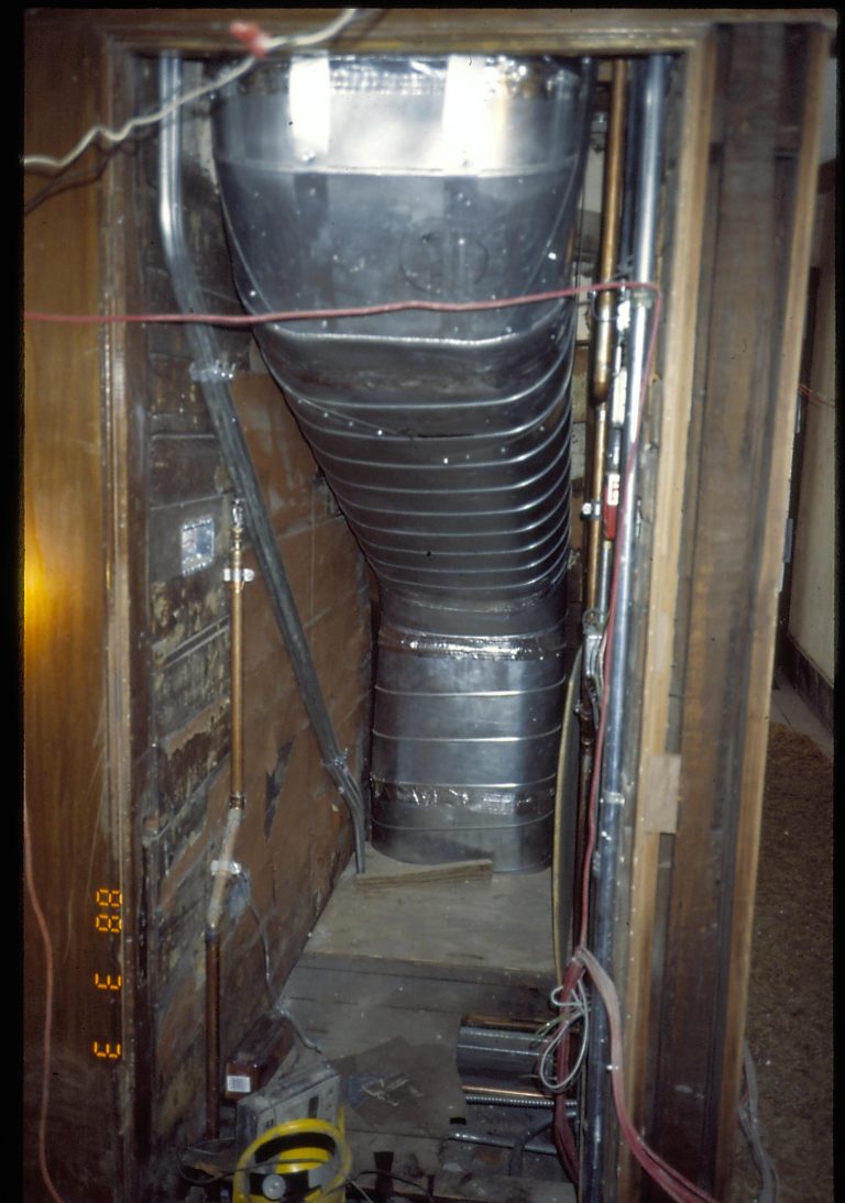 View of new HVAC ductwork installed during 1987-1988 Restoration. Ductwork is in first floor, Dining Room closet, under west stairwell. Photographer facing west.