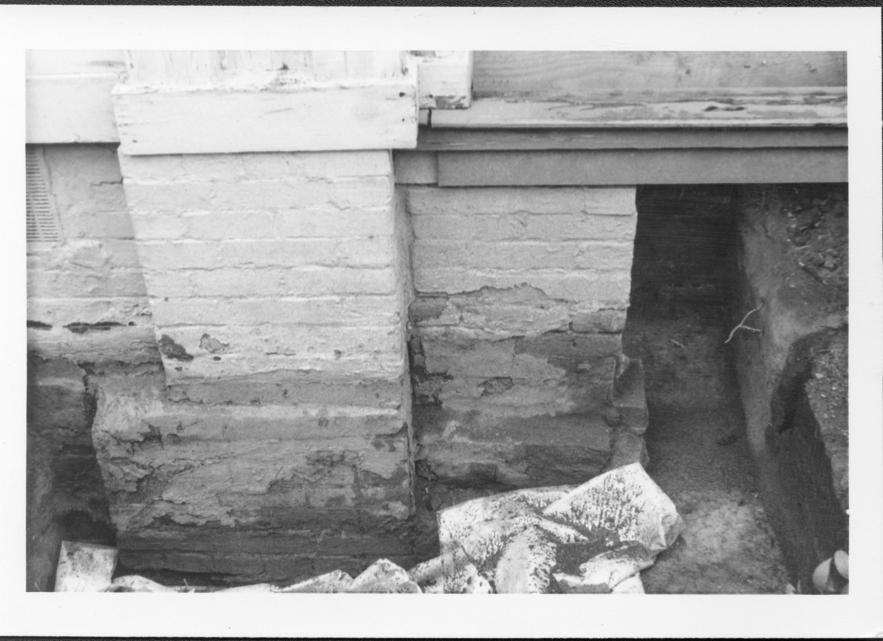 Foundation of Lincoln Home, near junction of south east pillar and south porch, during the 187-88 restoration. Photographer facing north. Basement/crawl space vent can be seen on the left side of the photo.