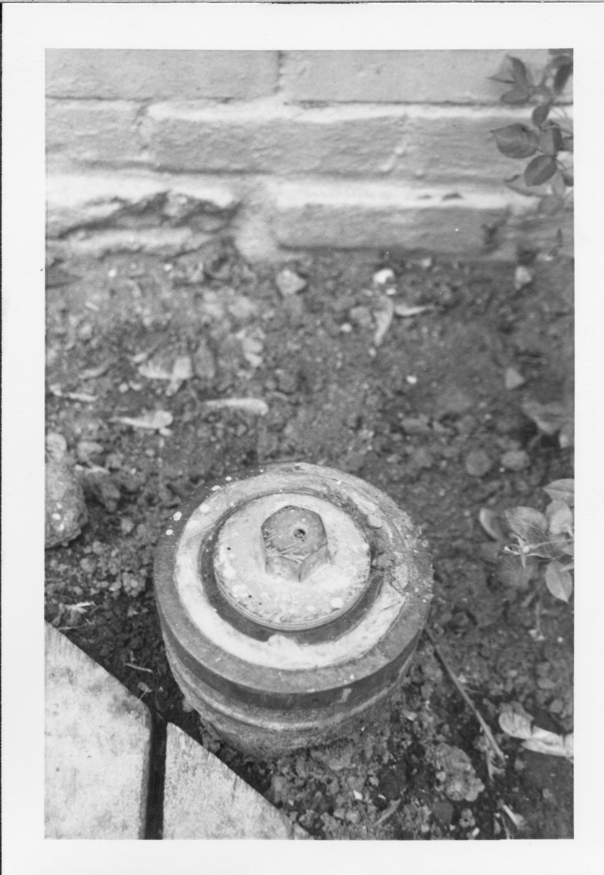 A capped pipe in the Lincoln Home yard. Exact location unknown.