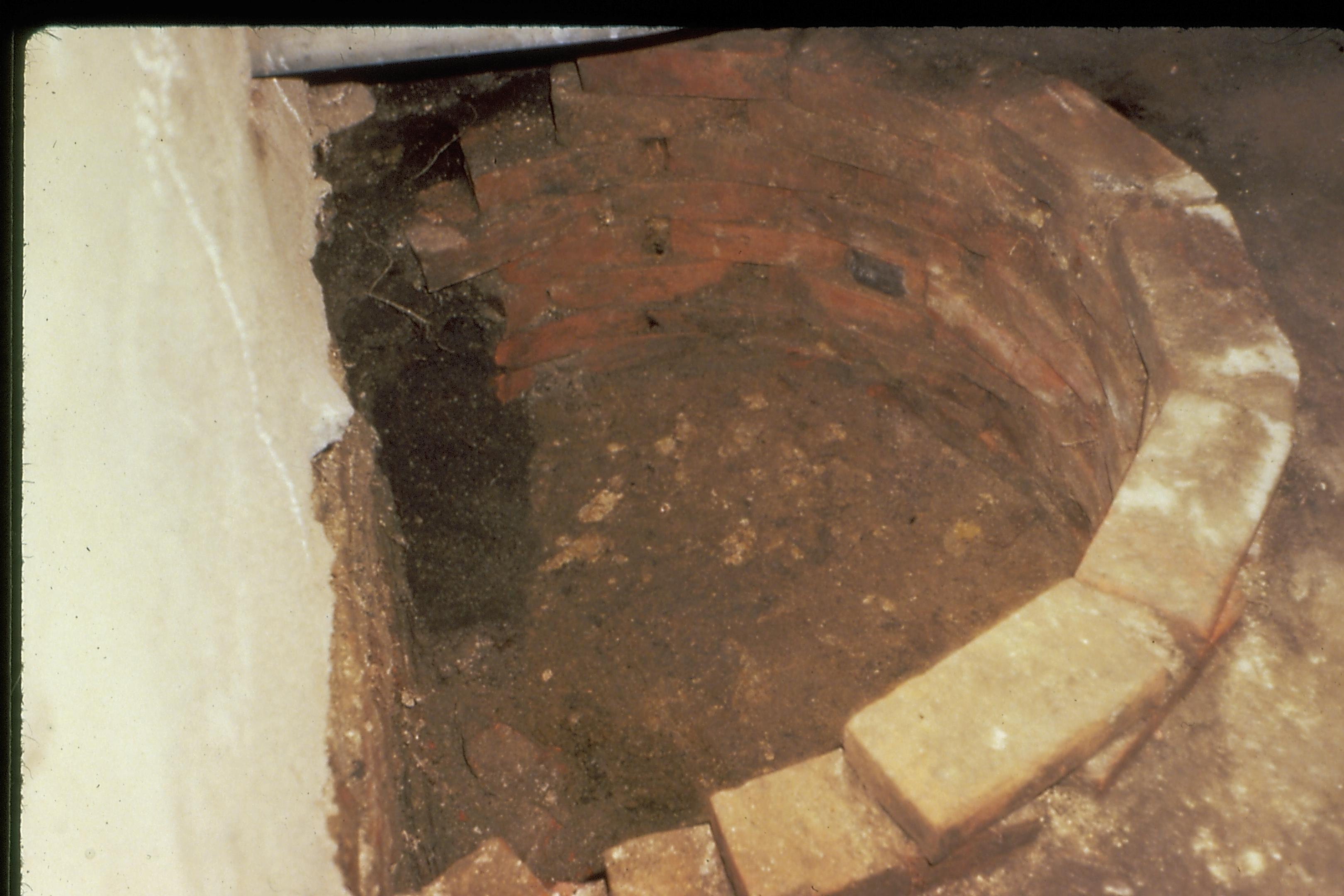 Lincoln Home ground water well, located under east porch of the Lincoln Home. This well was rendered inoperable when the east section of the home was moved south 6' in 1846. Photographer facing south.