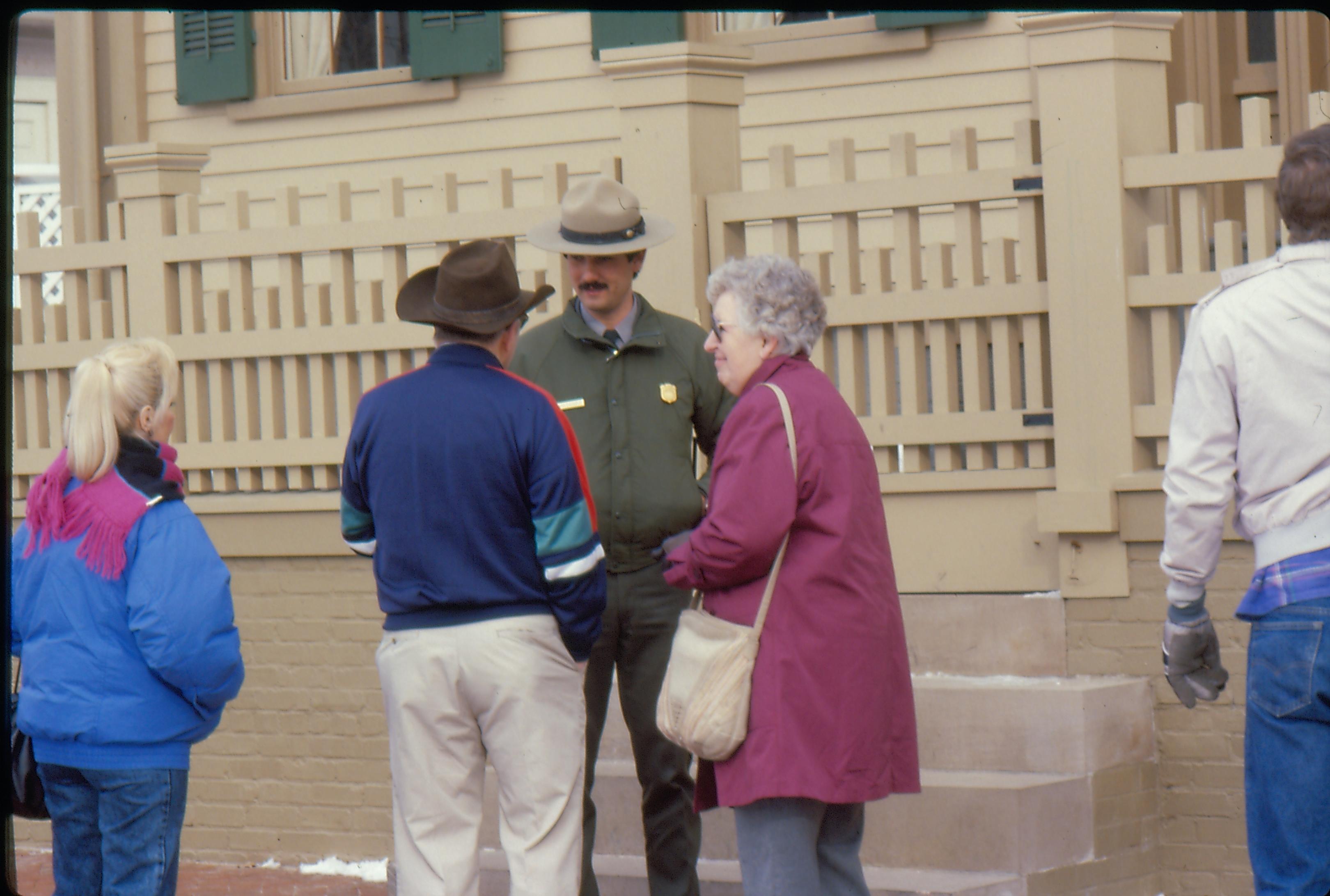 Visitors speak to a NPS ranger outside of the Lincoln Home front entrance, either before or after visiting hours. Photographer facing north east.